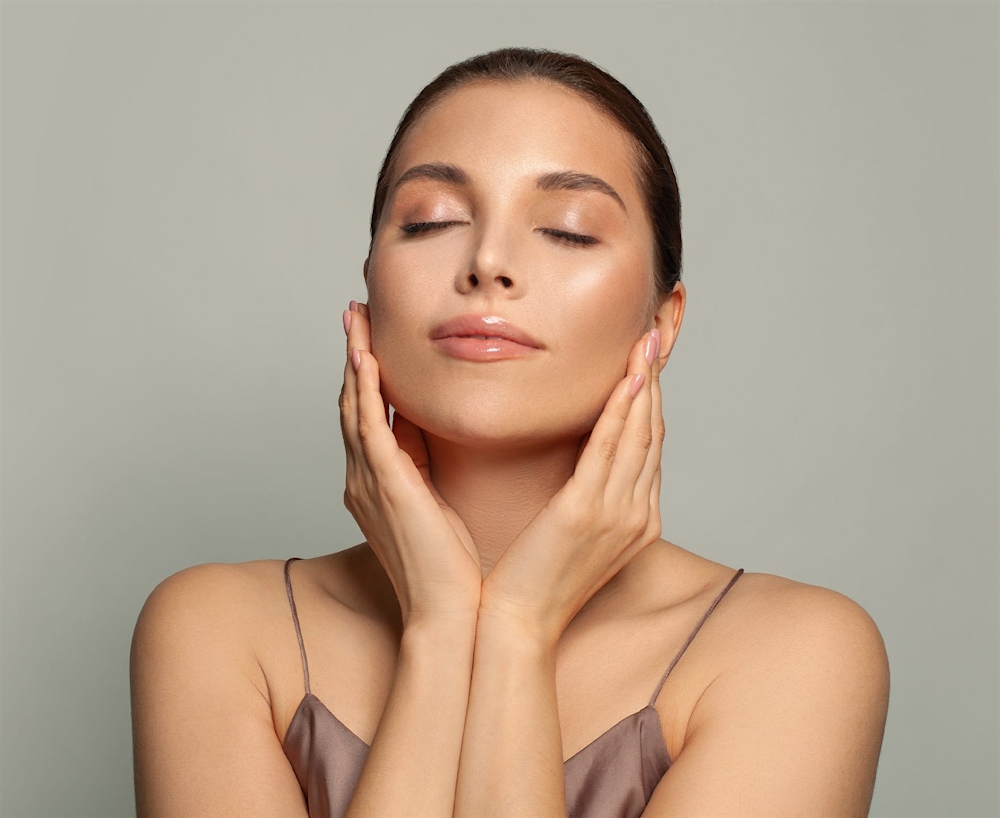 woman feeling her cheeks