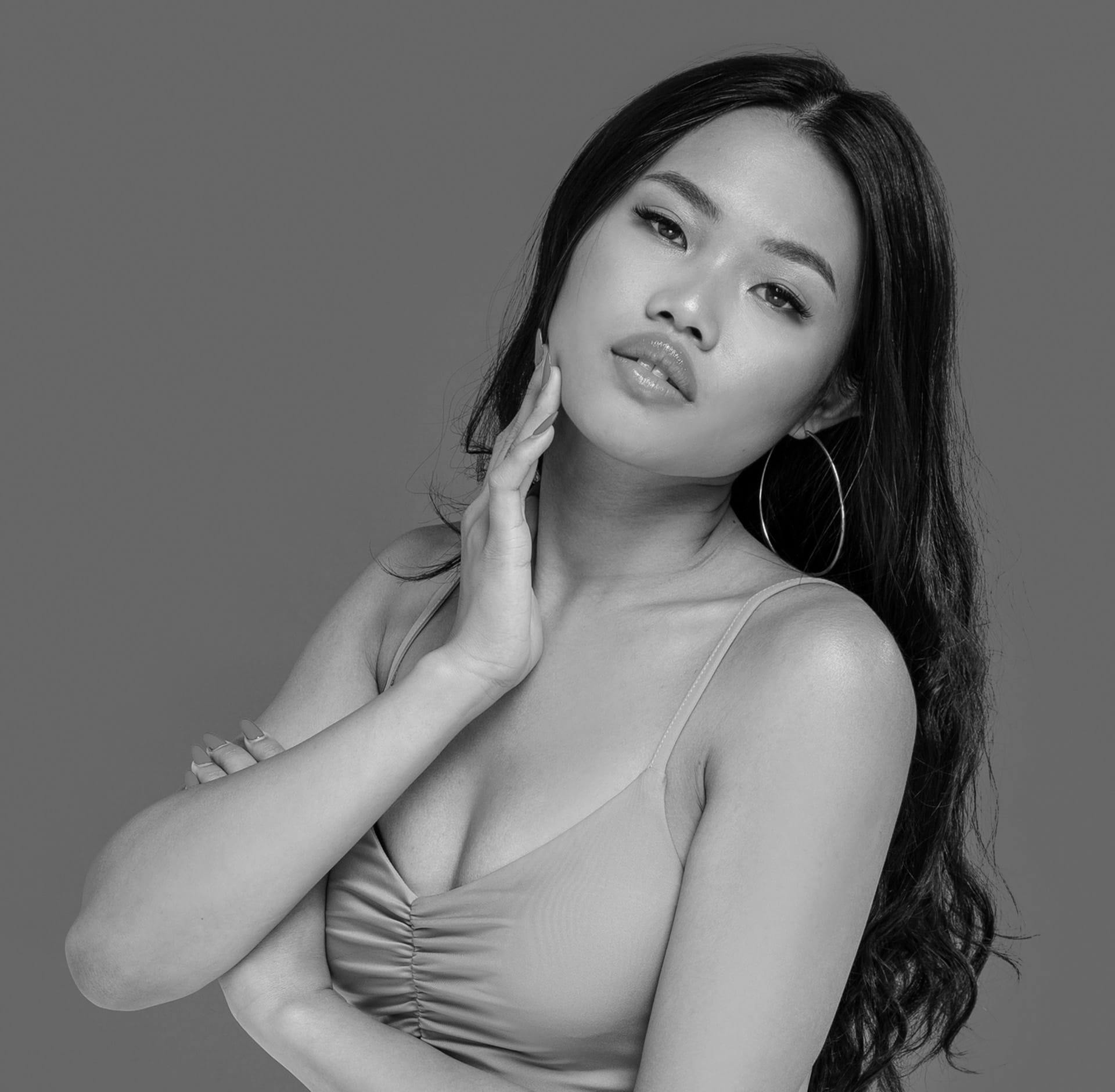 Woman posing with hand on face