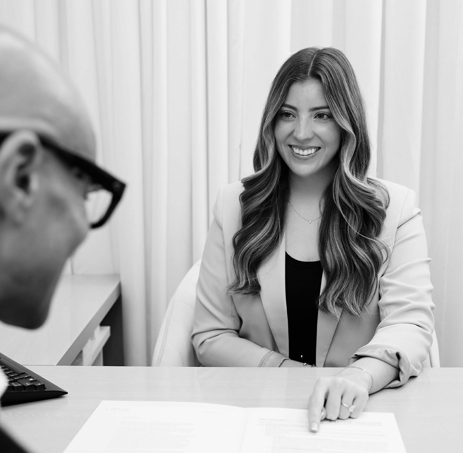Woman smiling at staff member
