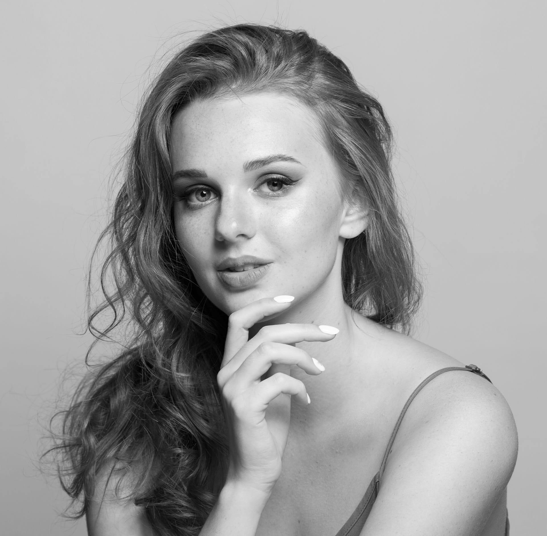 woman posing with chin in hand