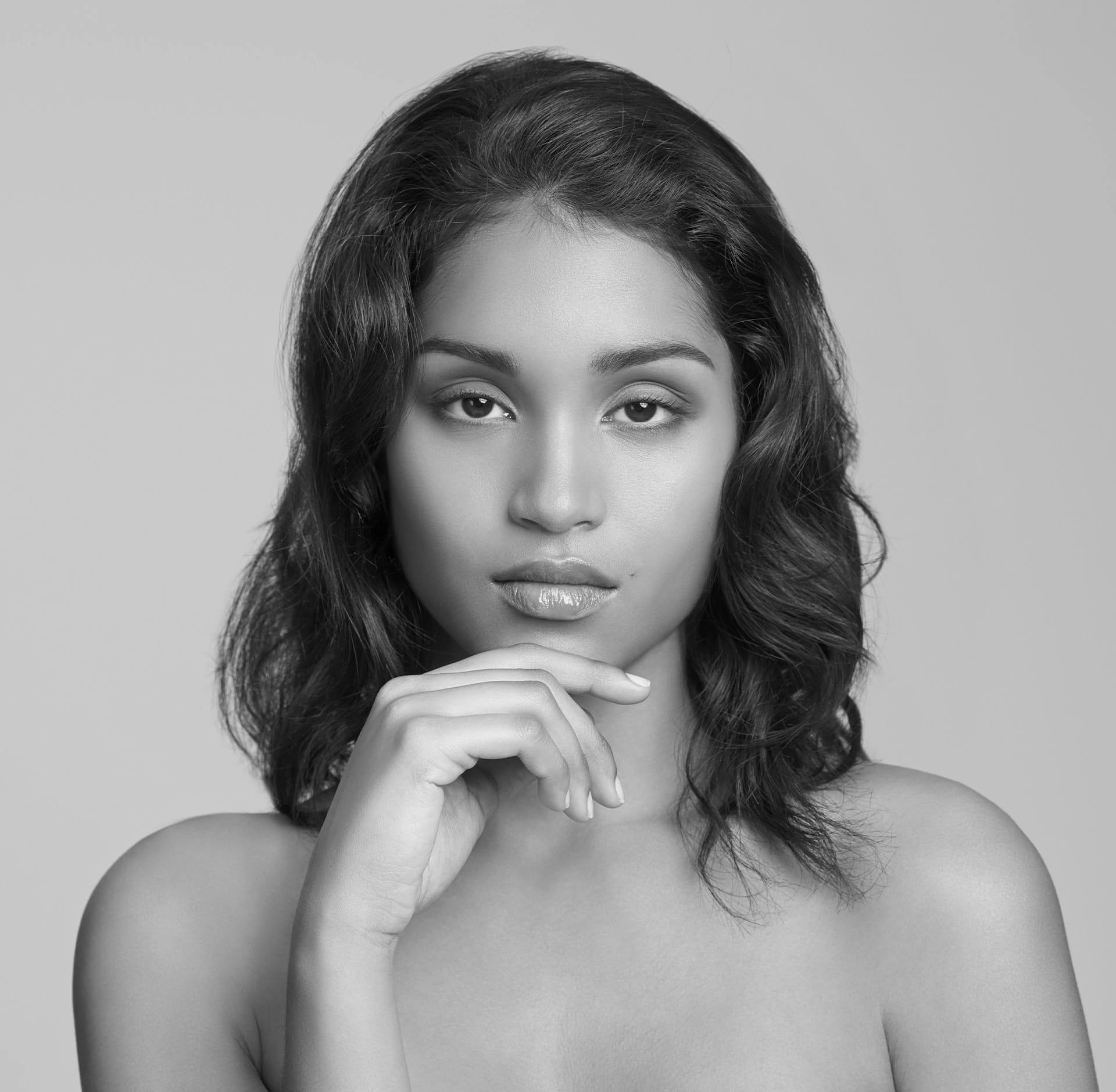 Woman resting her finger on her chin