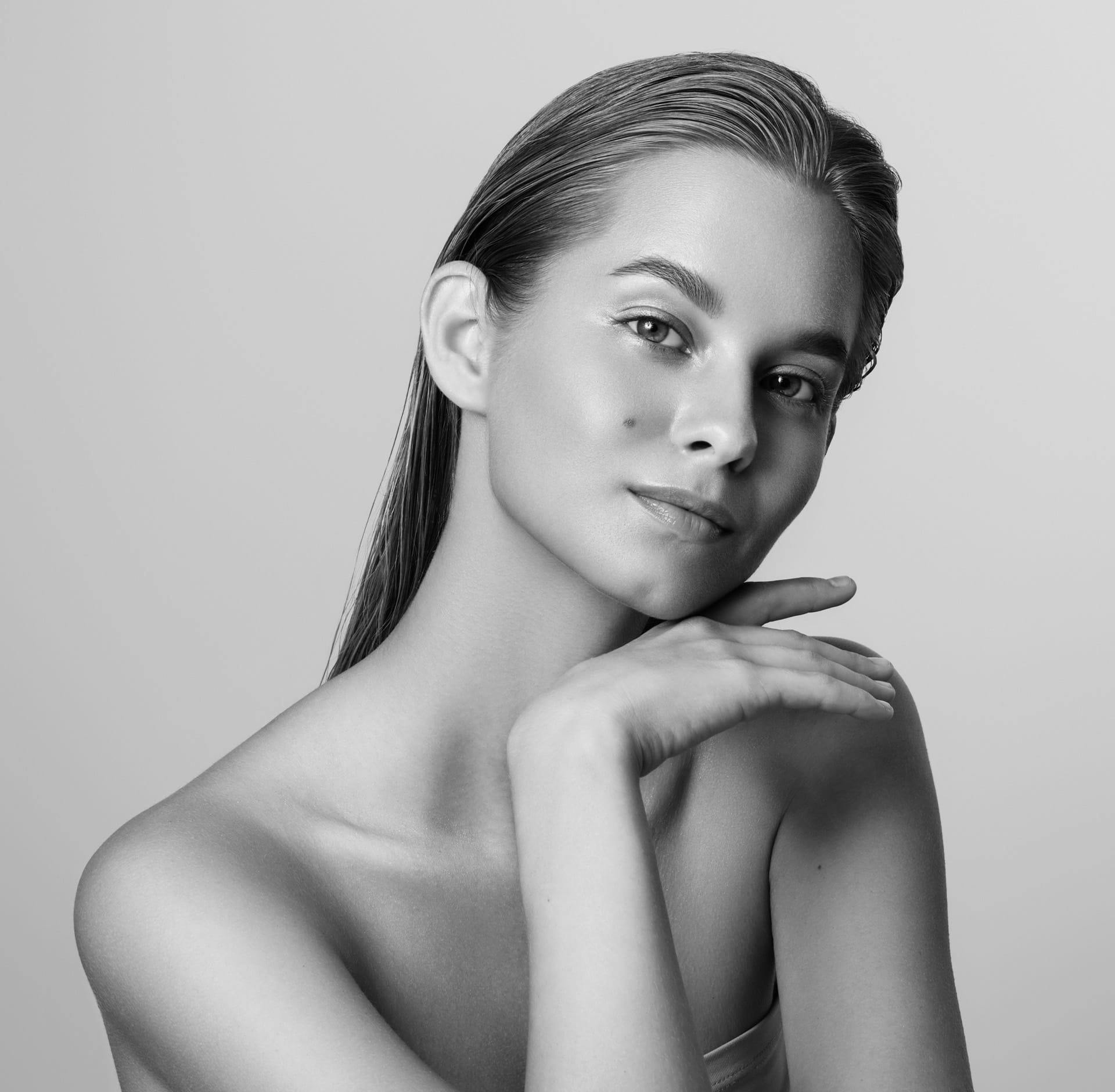 Woman resting chin on hand