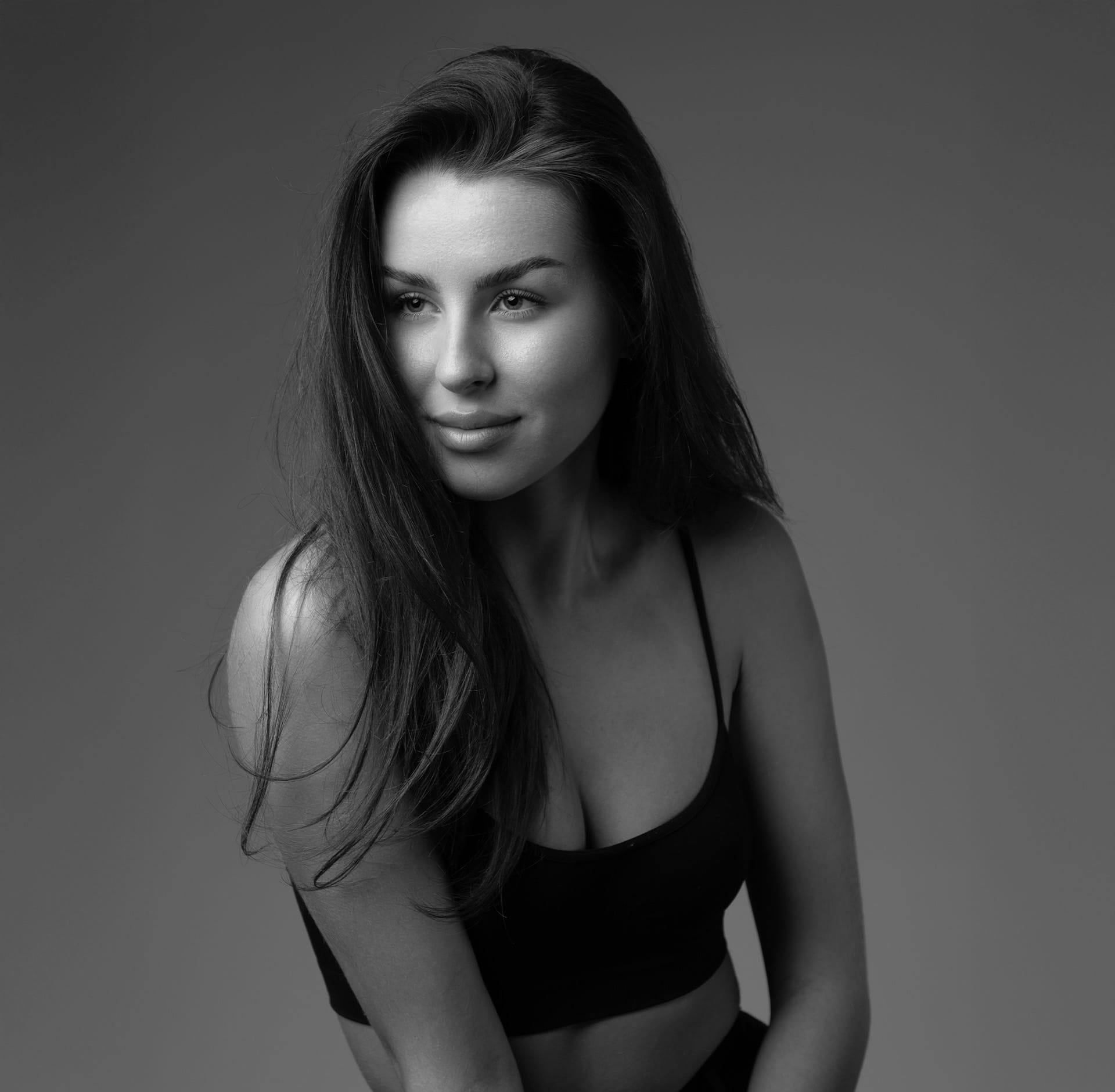 woman posing in black undergarments