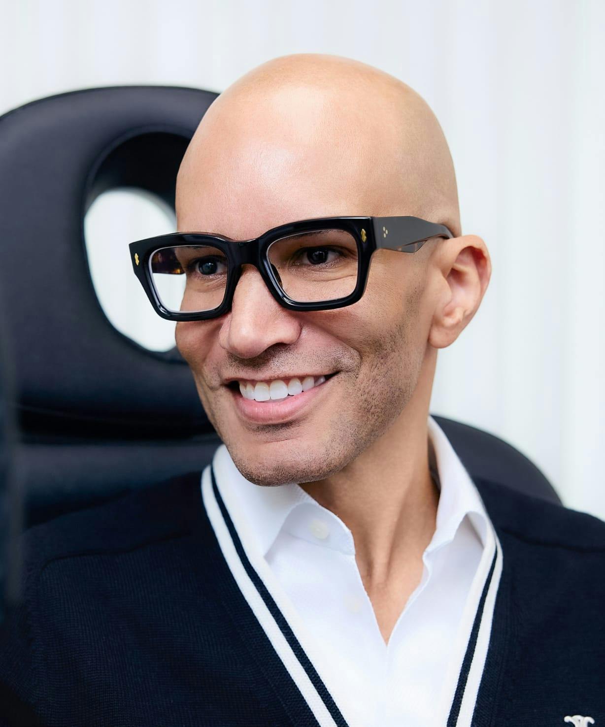 Bald man with glasses