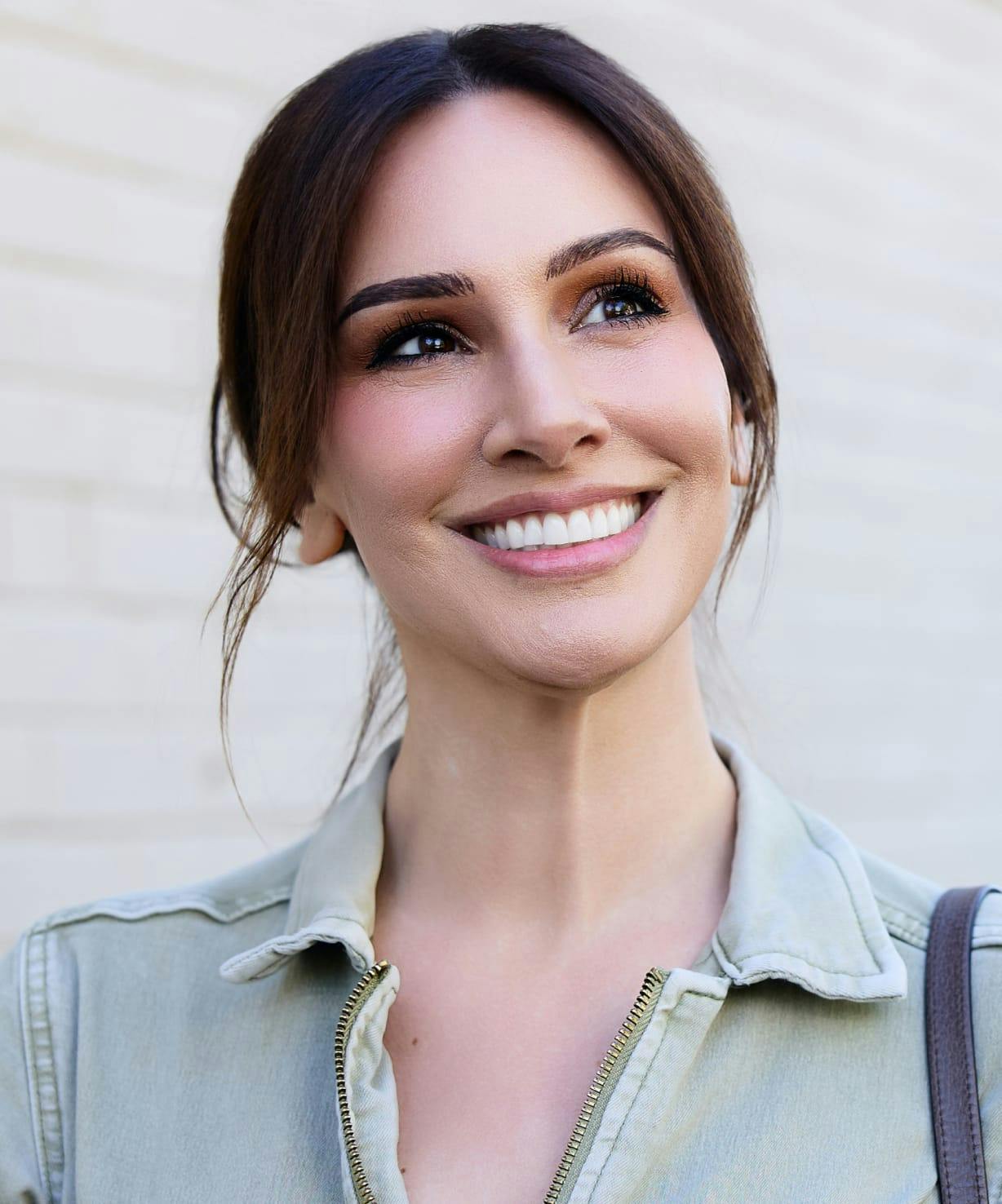 Woman with dark hair, smiling