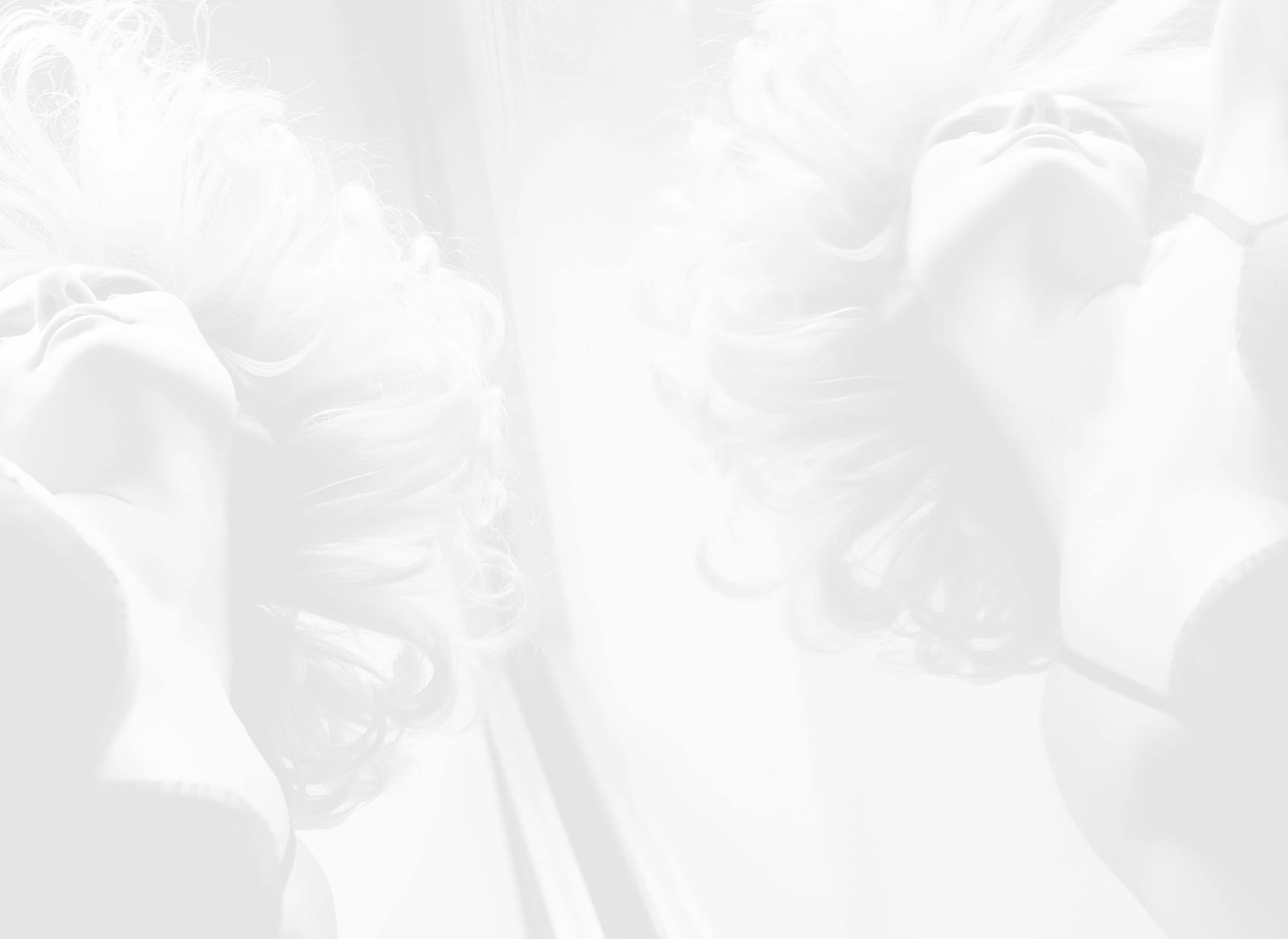 Faded image of a woman in a mirror