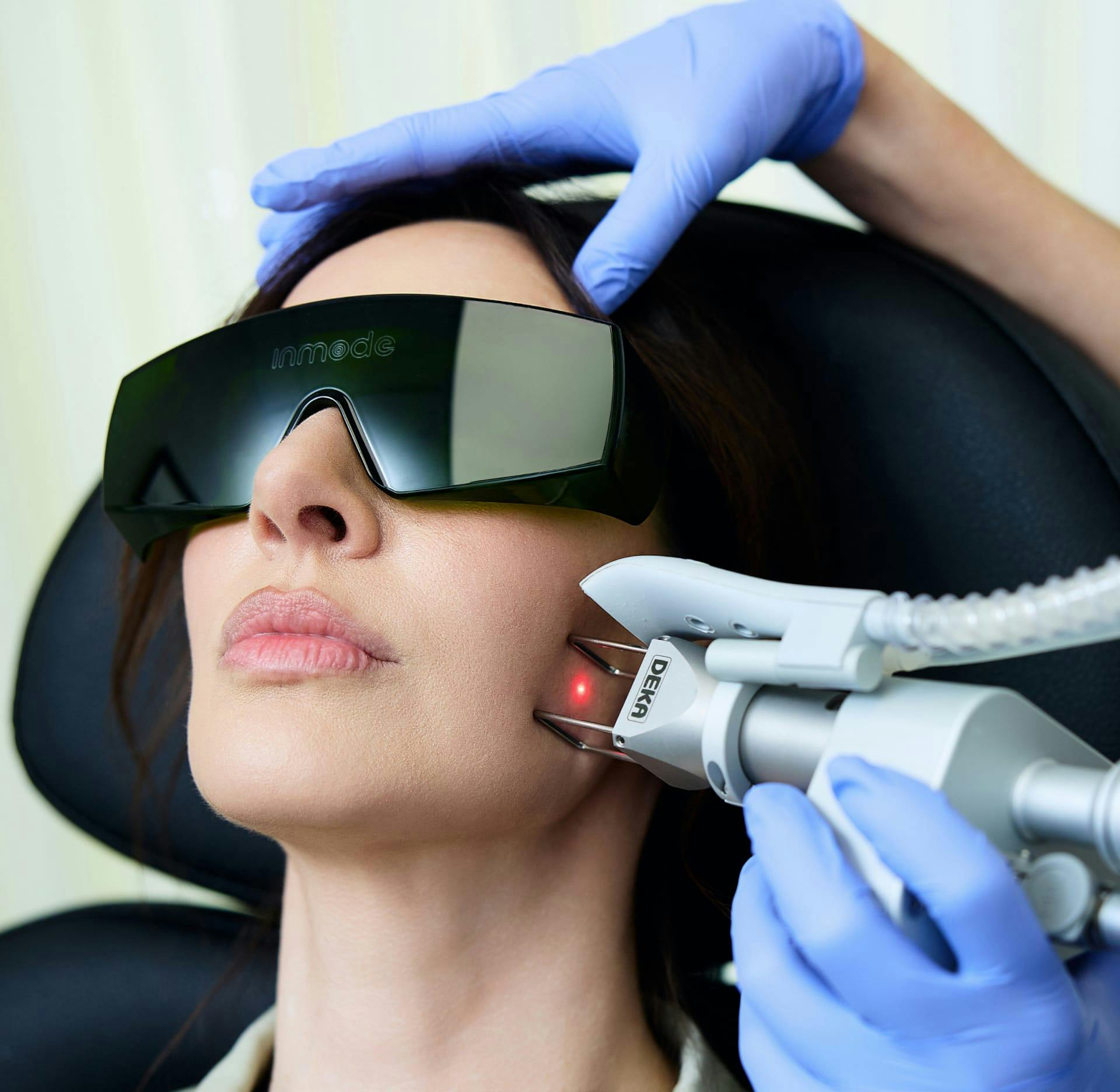 Woman getting a treatment on her face