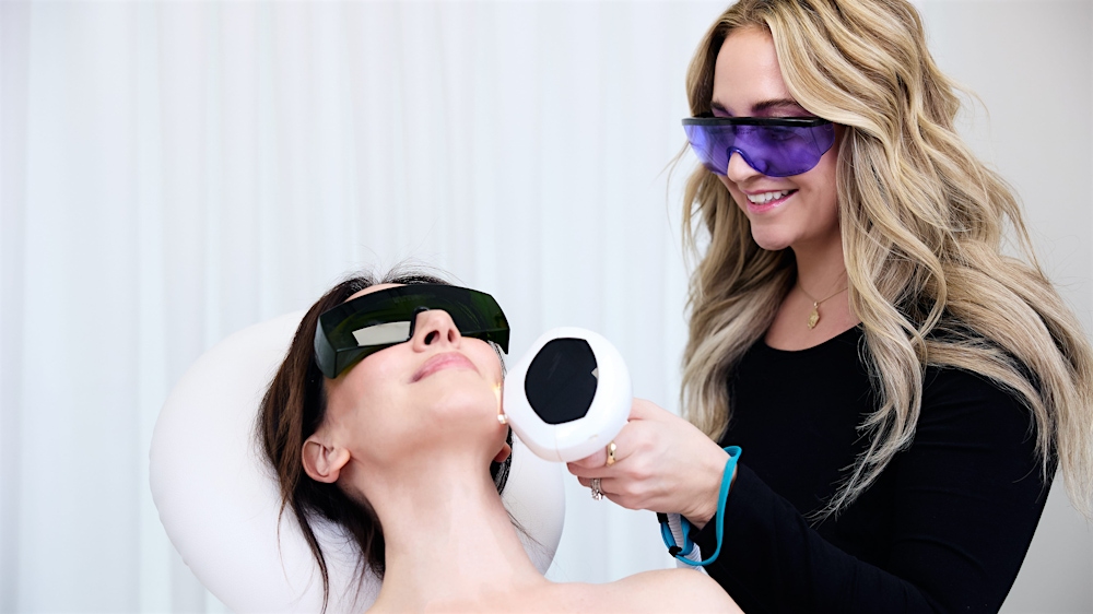 Nurse performing laser skin resurfacing on patient