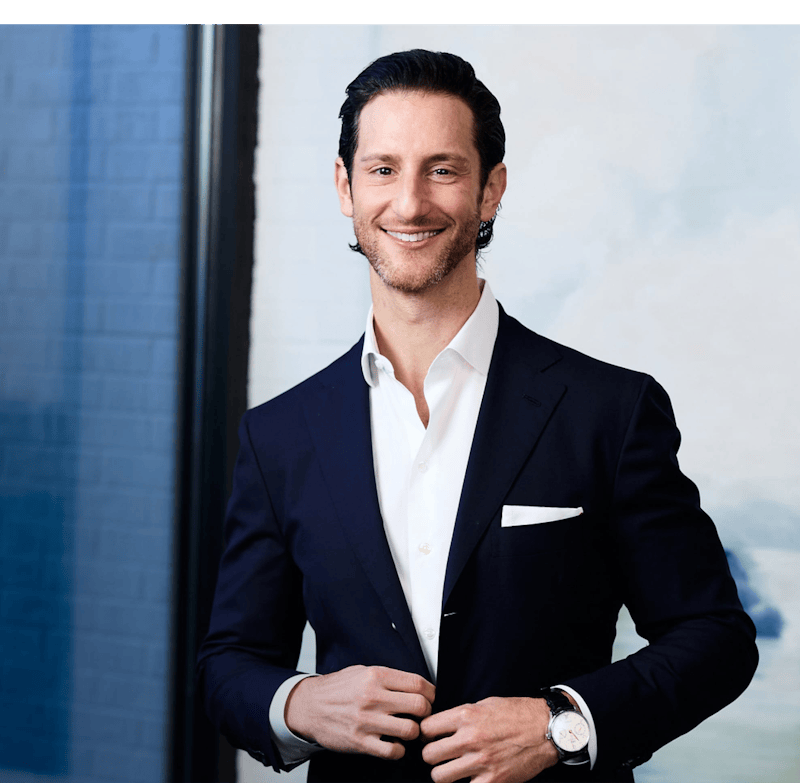 Dr. Jacob Unger in a blue suit