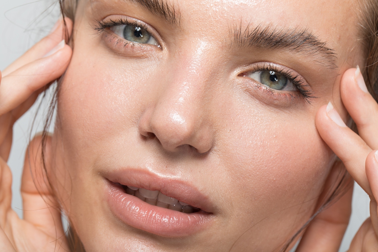 Gorgeous young woman with wrinkle free skin looks at camera. Her perfect skin emulates the potential results of BOTOX in Nashville