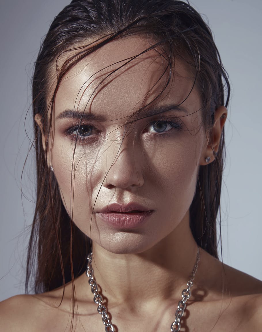 Gorgeous young woman with wrinkle free skin looks at camera. Her perfect skin emulates the potential results of BOTOX in Nashville