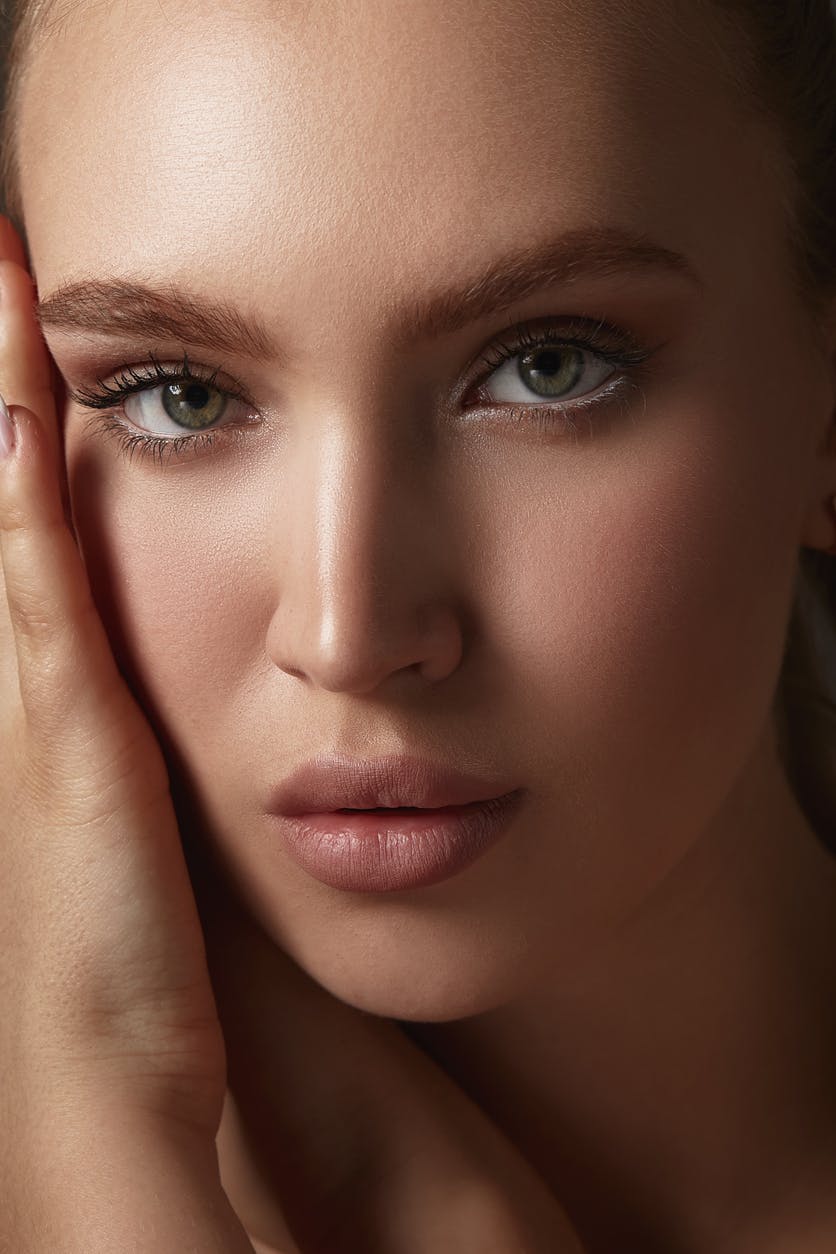 Gorgeous young woman with wrinkle free skin looks at camera. Her perfect skin emulates the potential results of BOTOX in Nashville