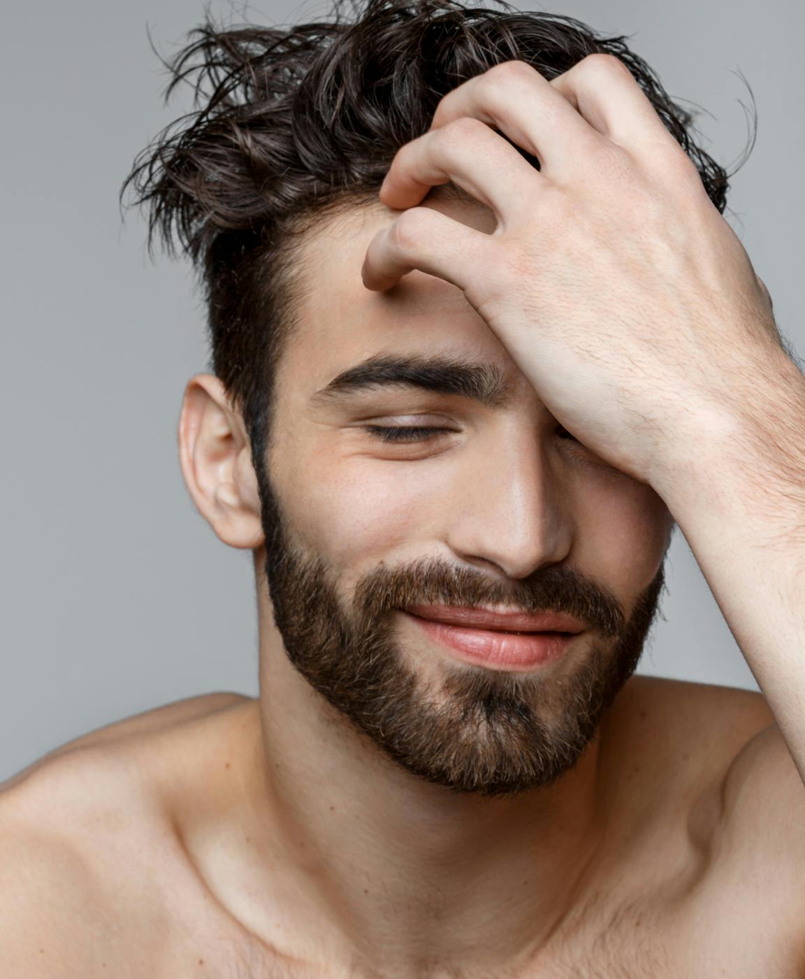 A man smiling after treatment with a hair restortaion specialist in Delray Beach.
