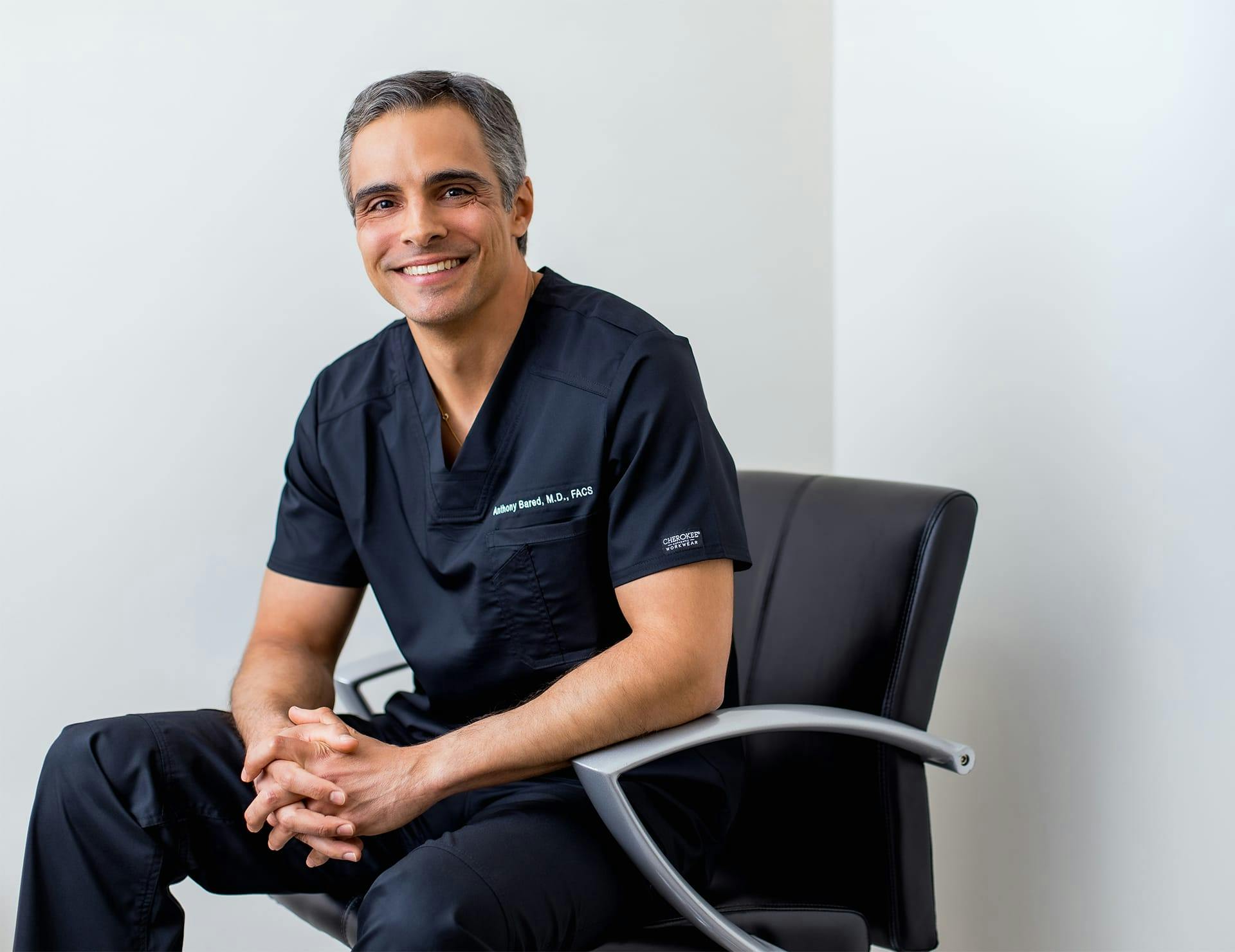 Dr. Anthony Bared sitting