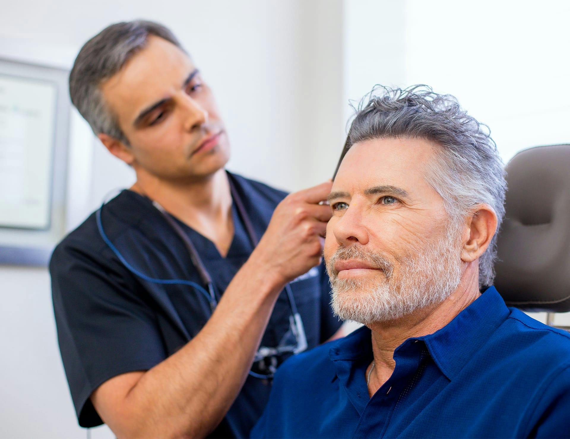 Male client getting PRP hair restoration in Miami.