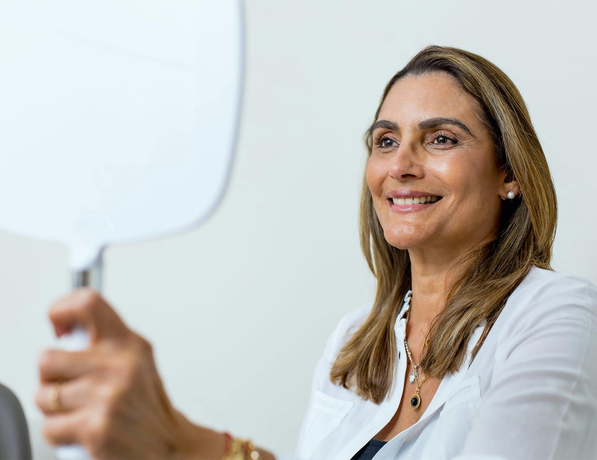 A woman getting female hair restoration in Delray Beach.
