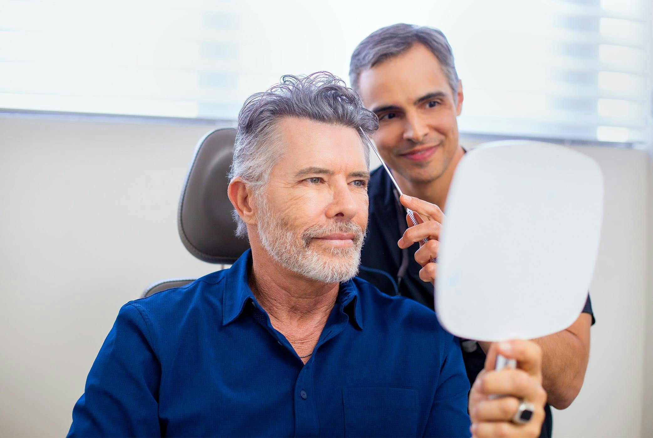 Man getting a consultation for hair transplant surgery in Miami.