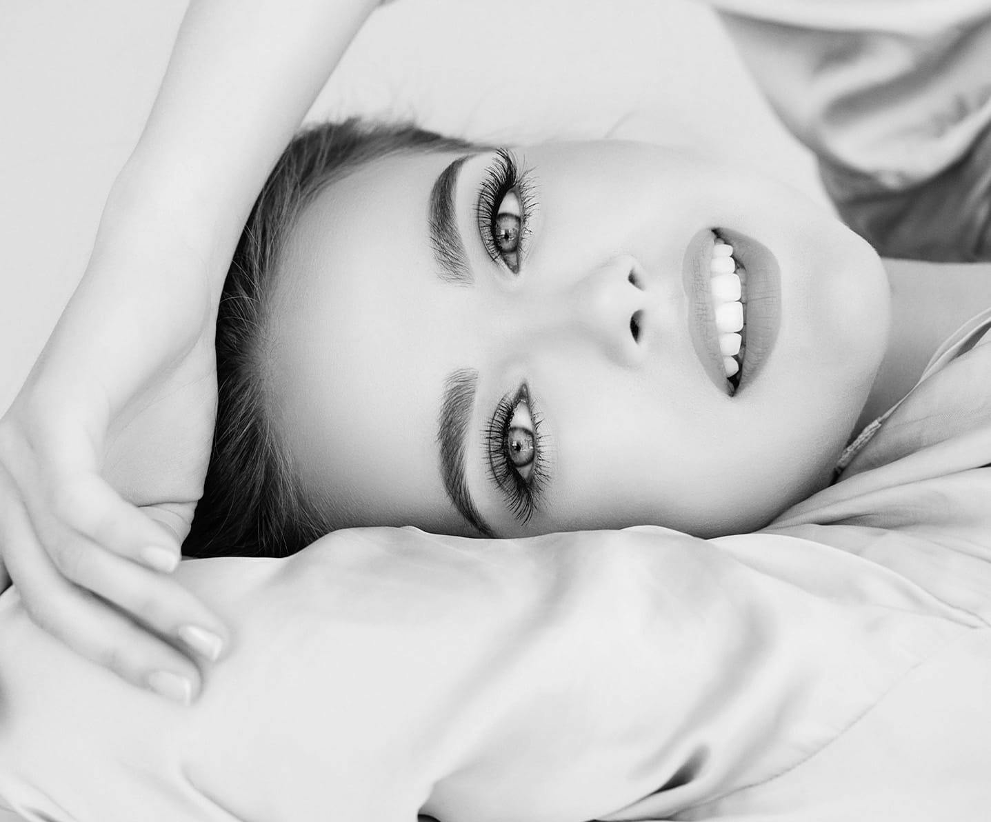 smiling woman laying down