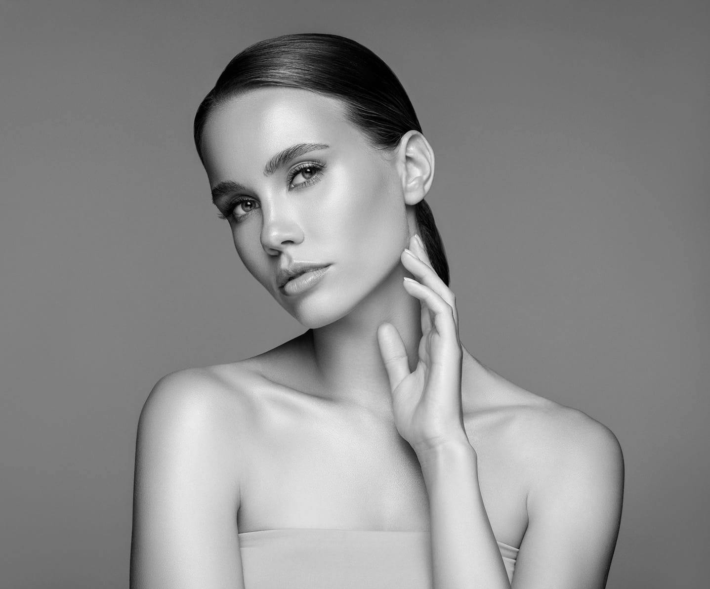 woman touching her jaw