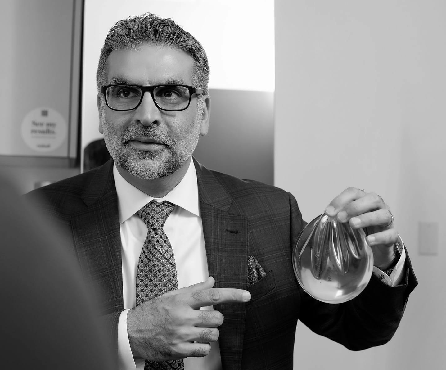 Dr.Fazilat pointing at breast implant