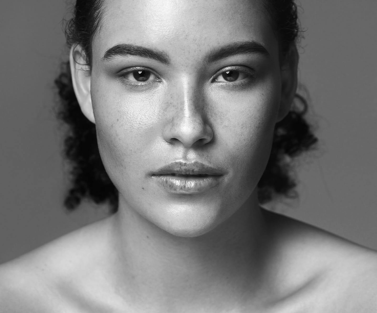 freckled face model staring into lens