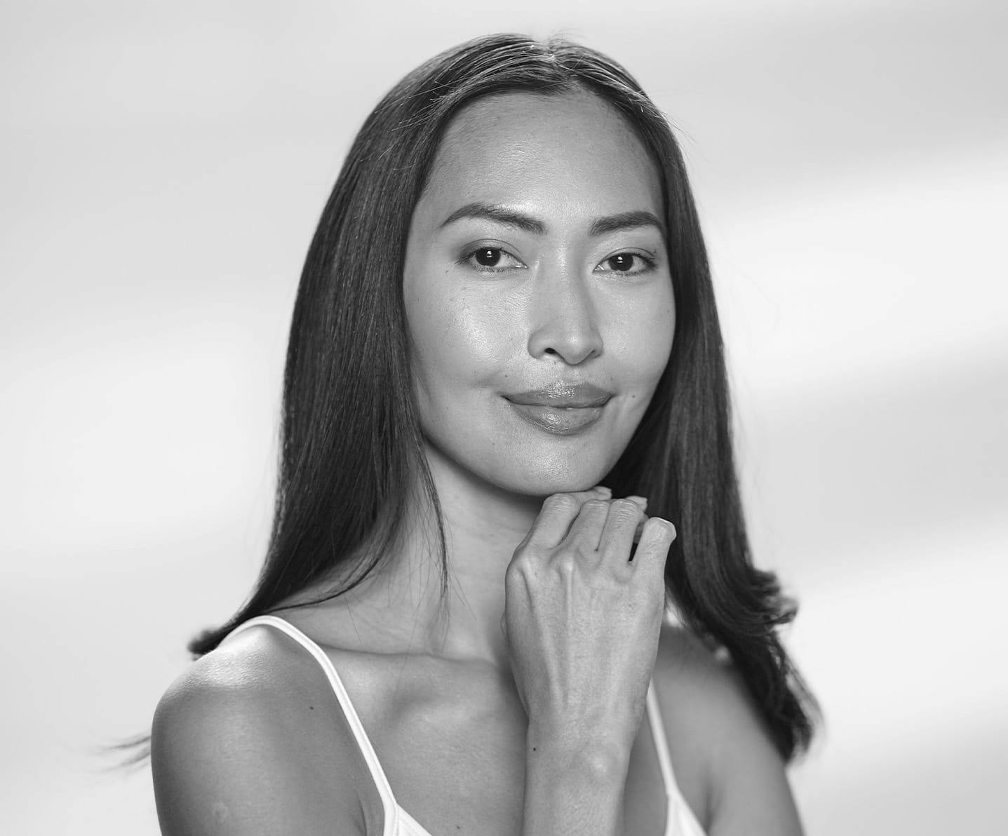 woman touching her chin