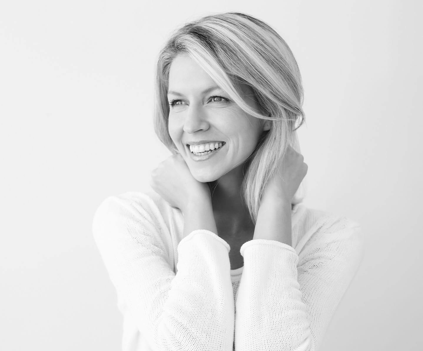 woman holding her neck