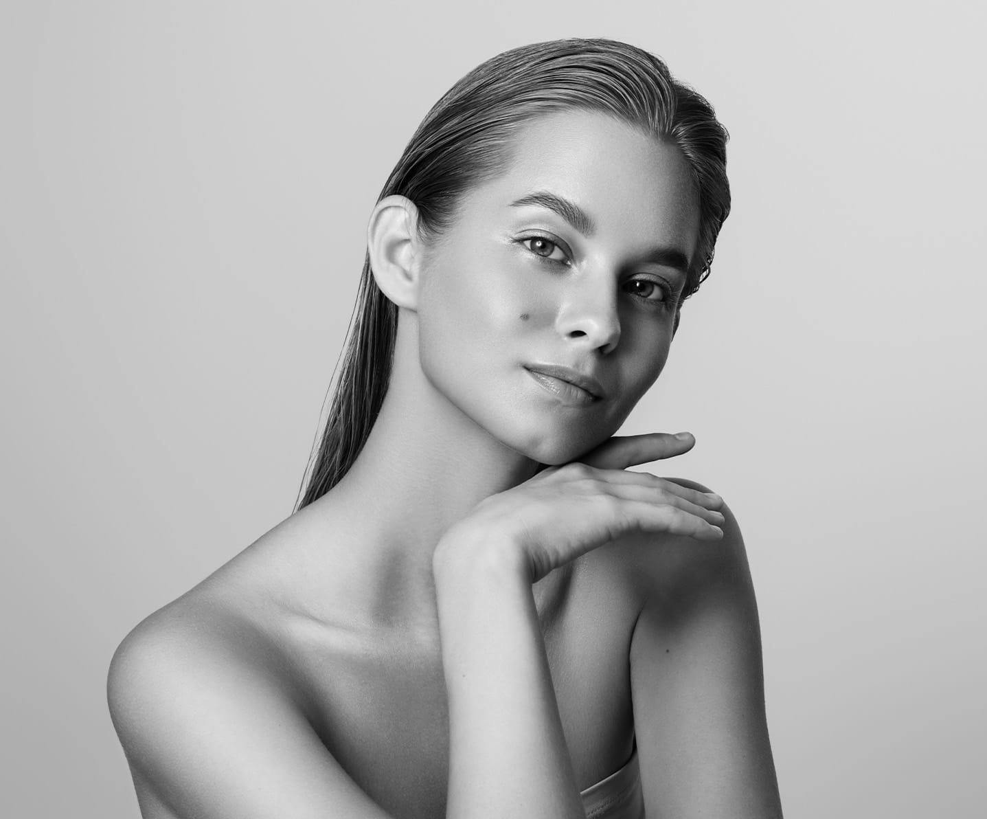 woman resting her chin on her hand