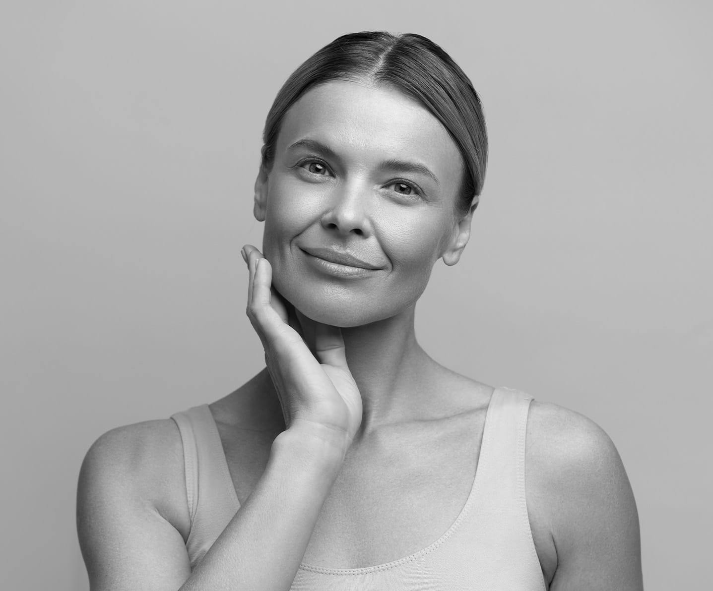 woman touching her jaw