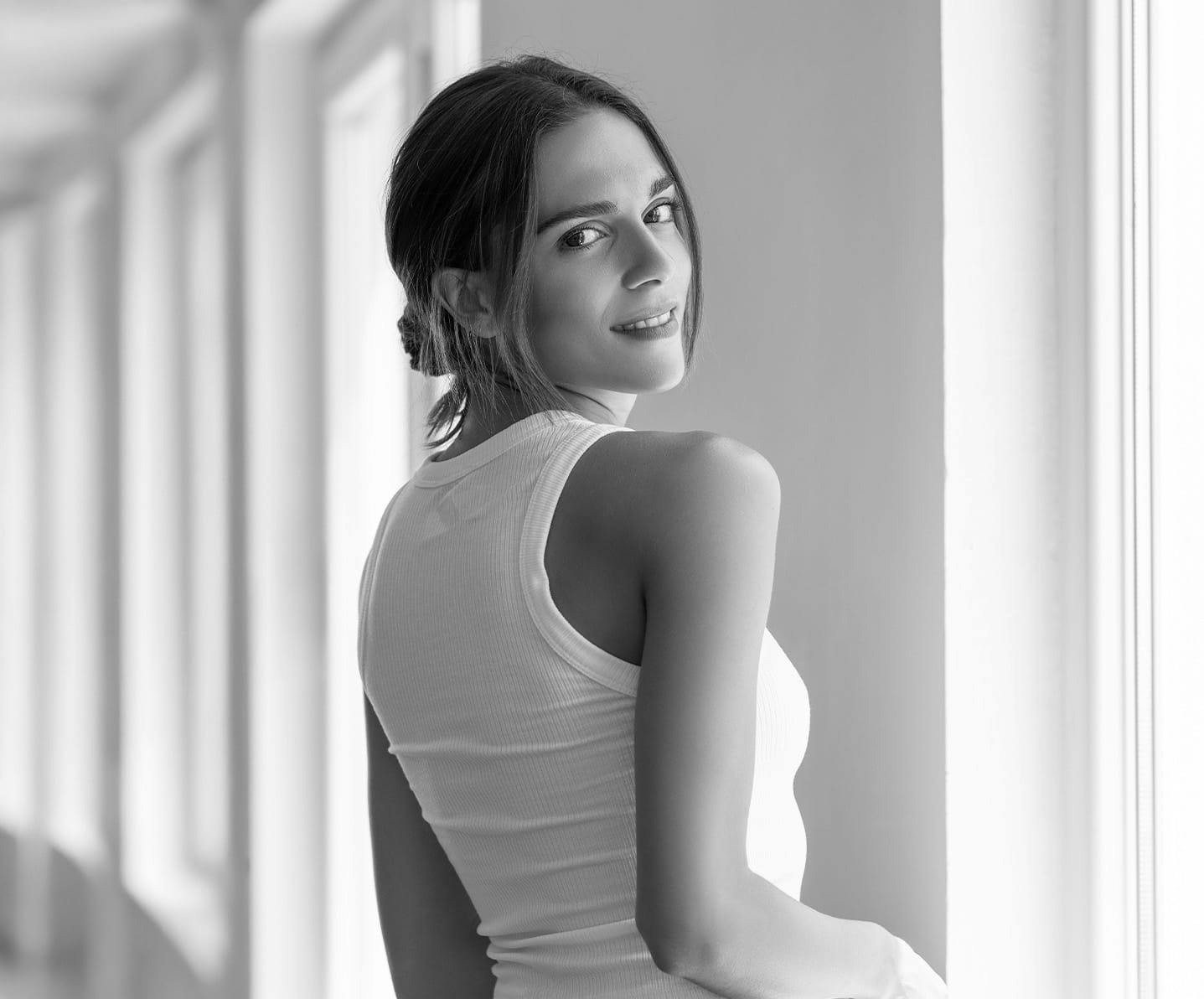 woman looking over her shoulder