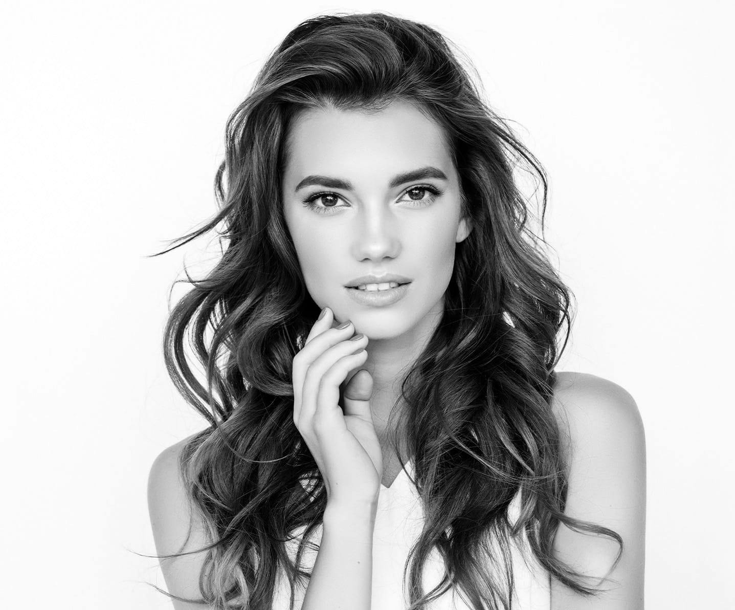 woman touching her jaw