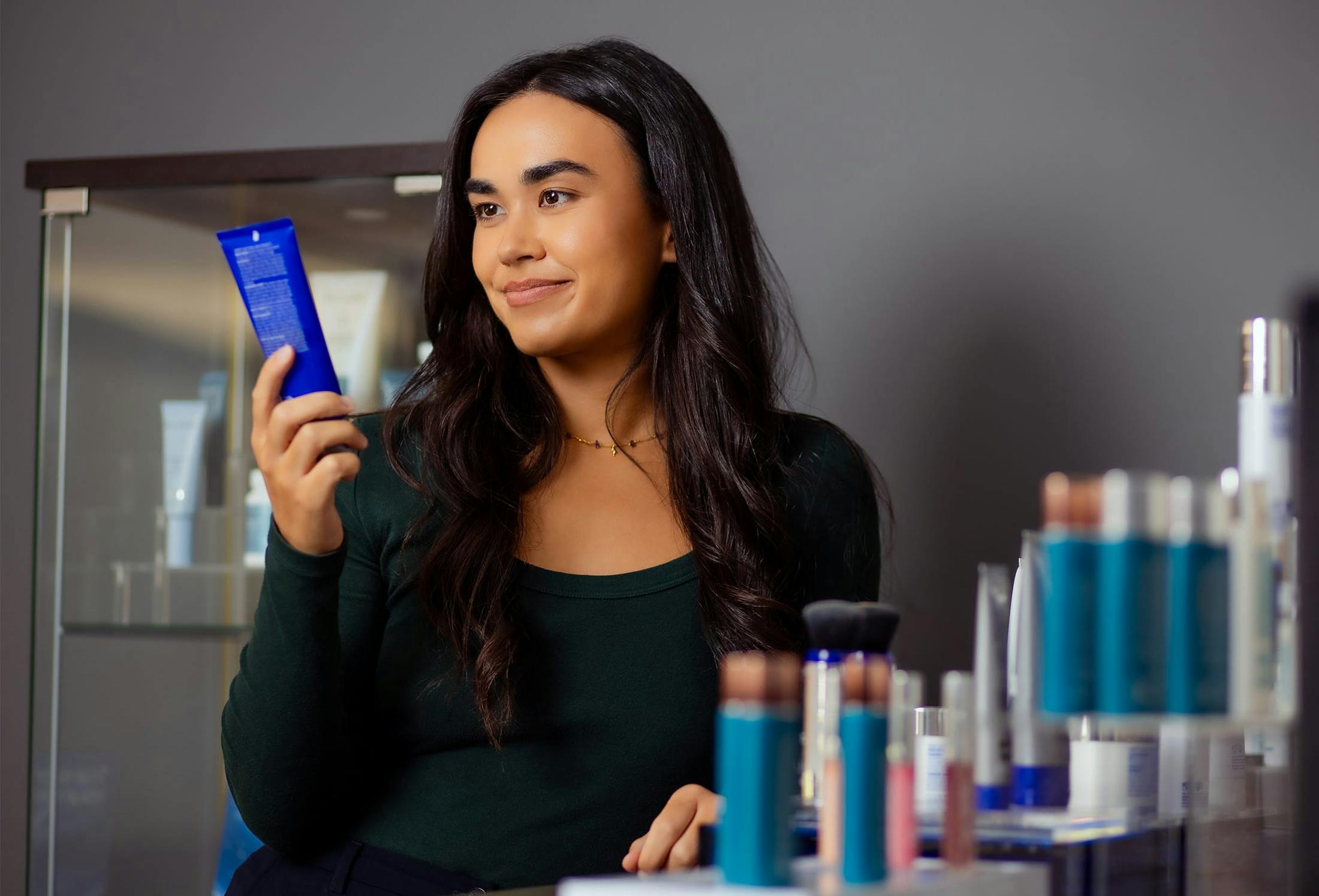 woman looking at skin care products