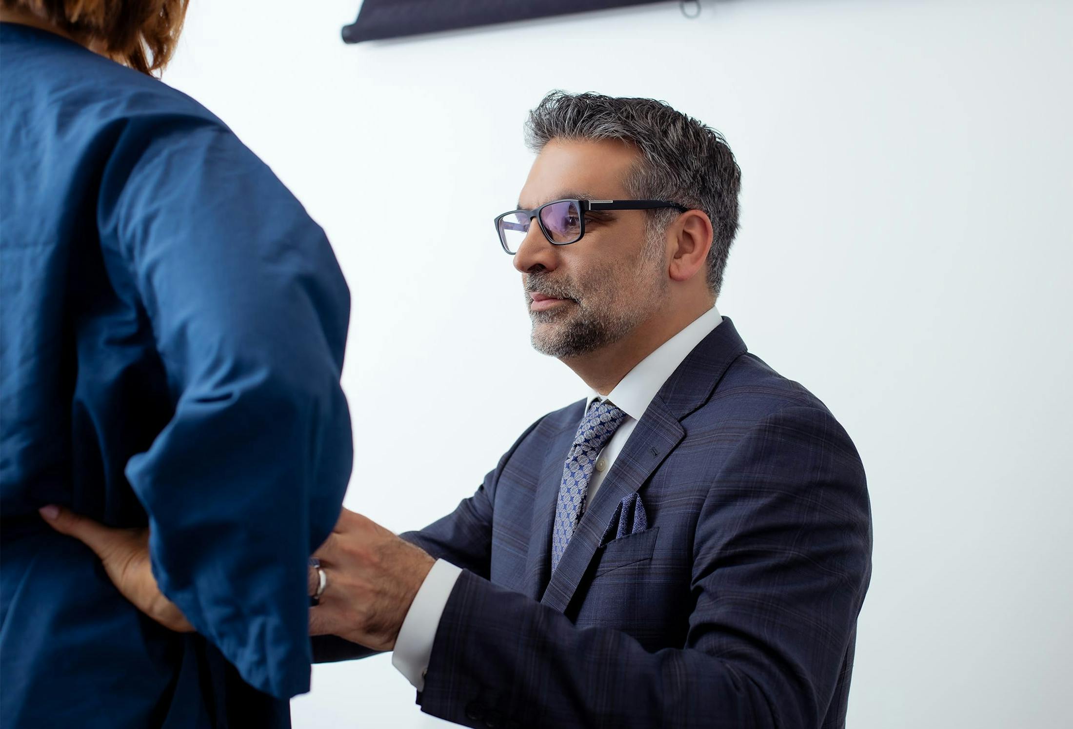 Dr. Fazilat examining a patient's stomach