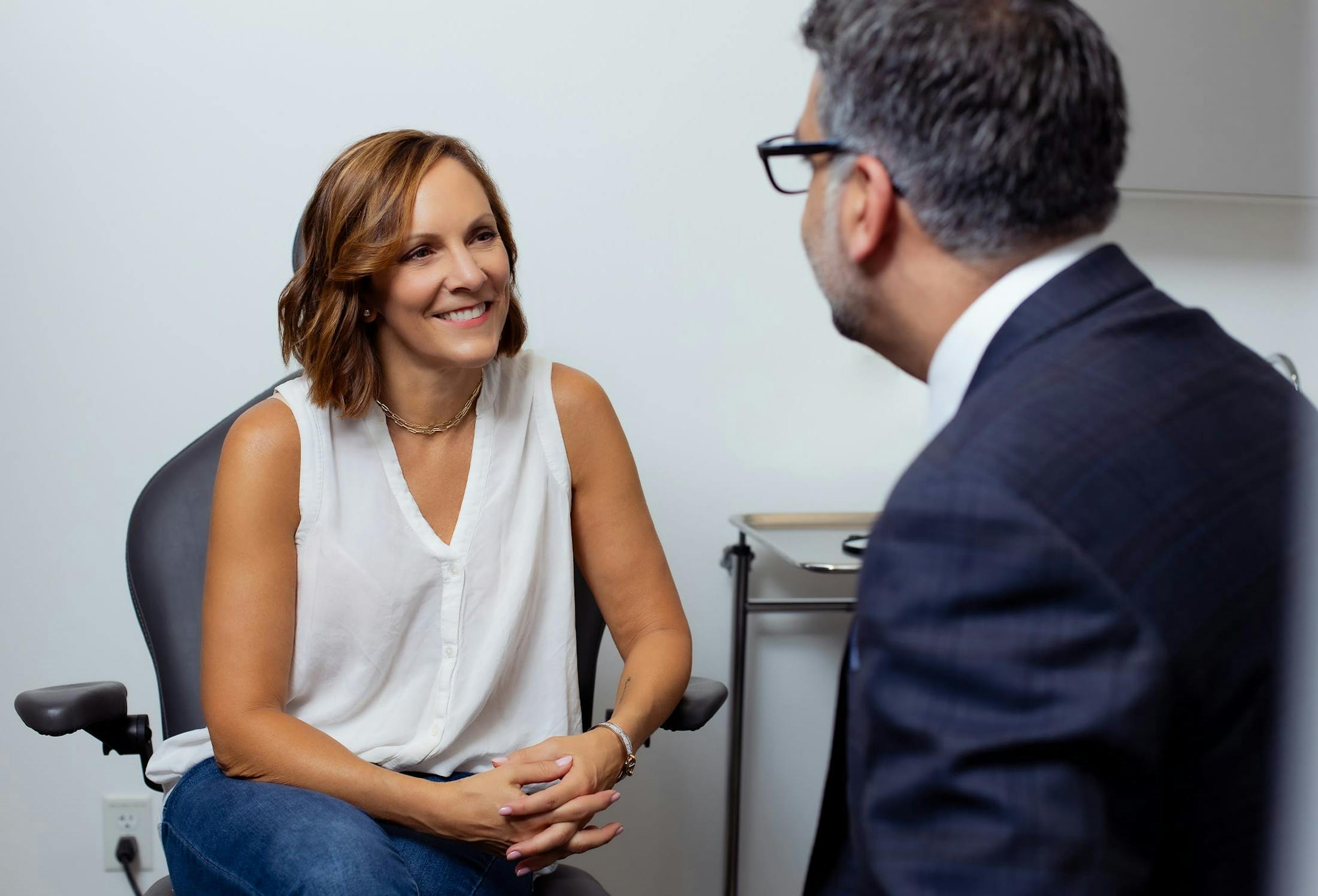woman smiling at the doctor