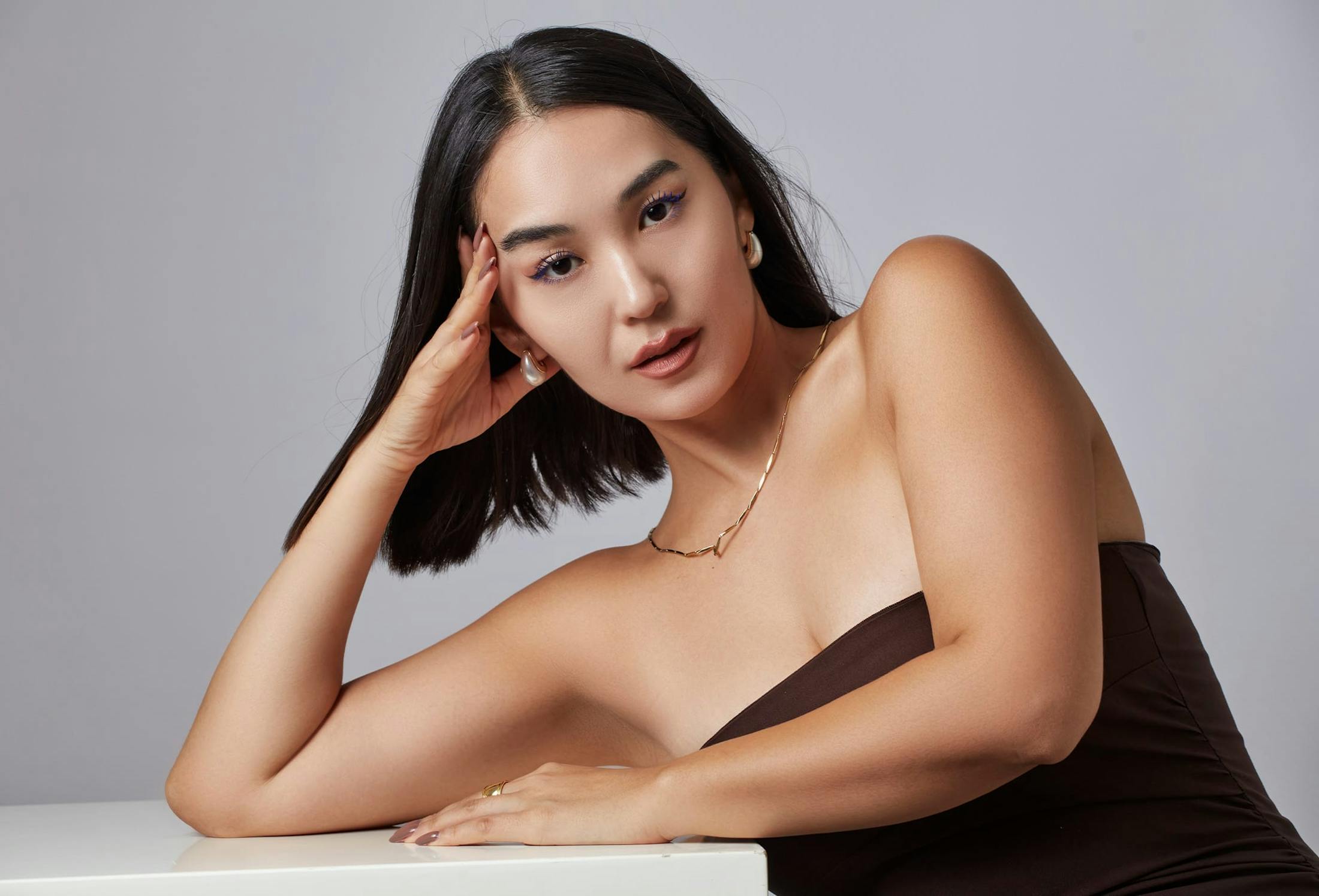 woman leaning on a table