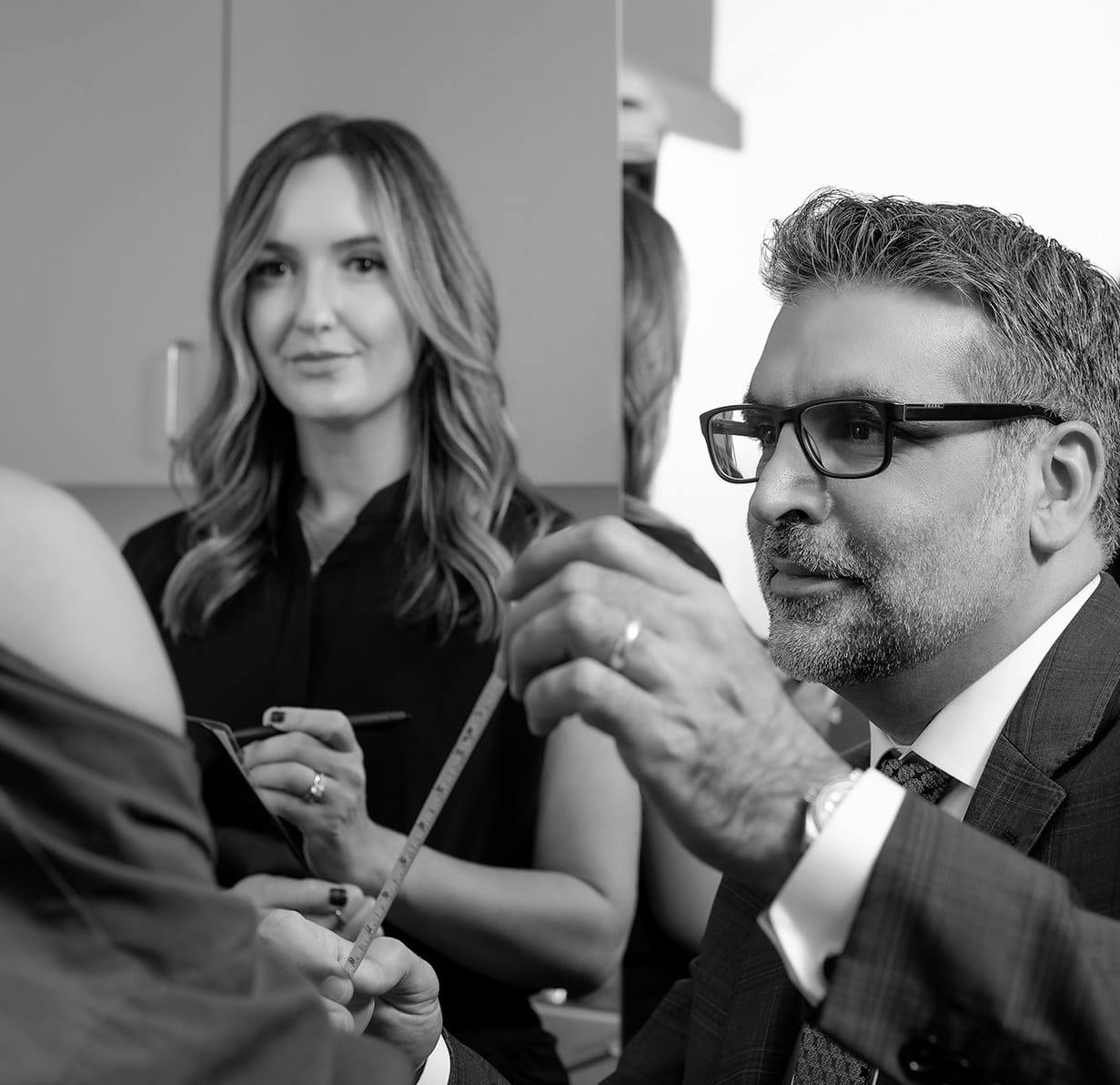 Dr. Fazilat measuring a woman's chest