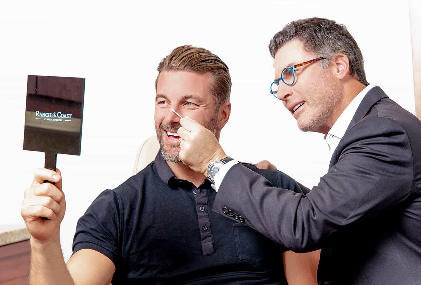 doctor examining mans nose