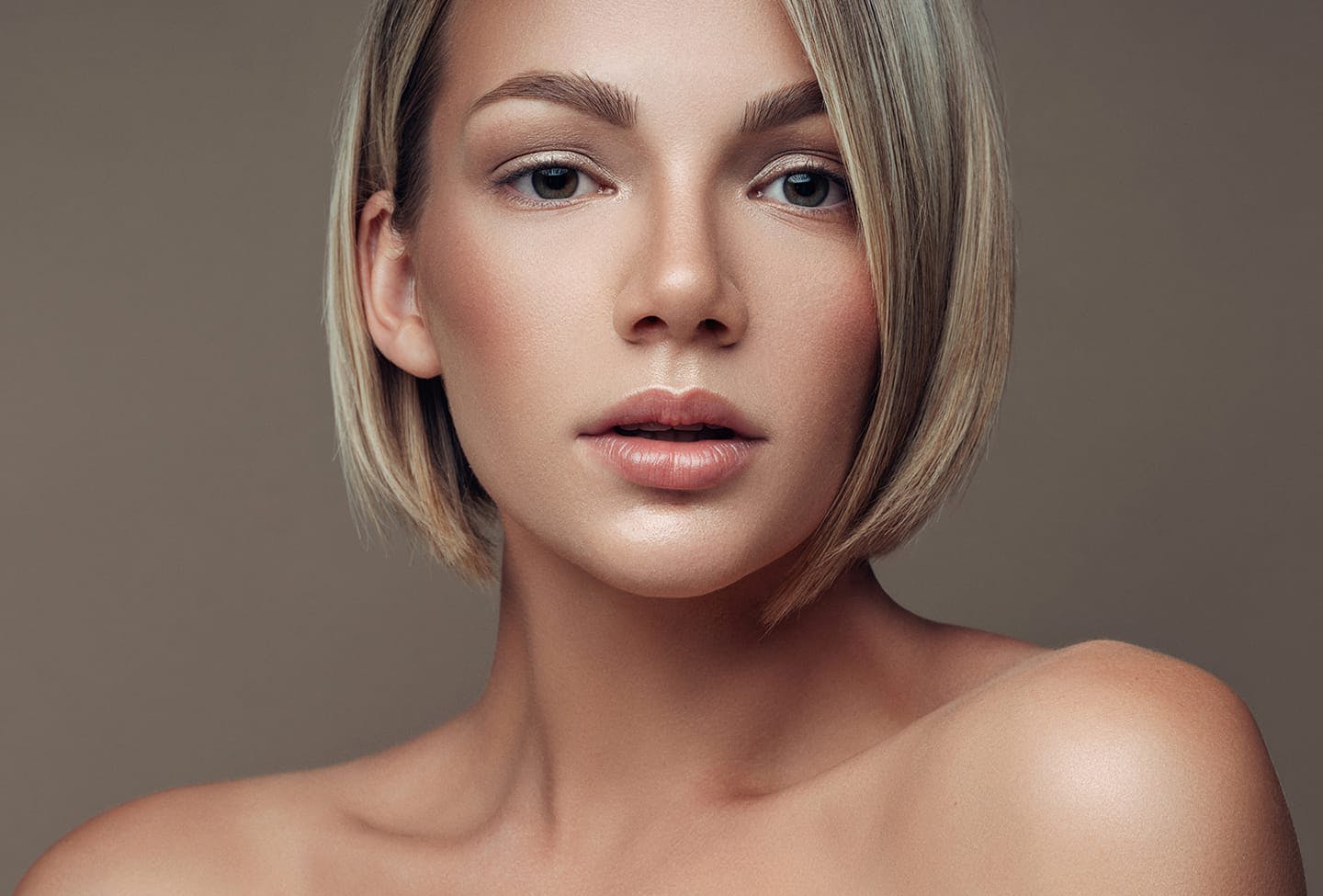 Model with short hair looking dramatically into camera