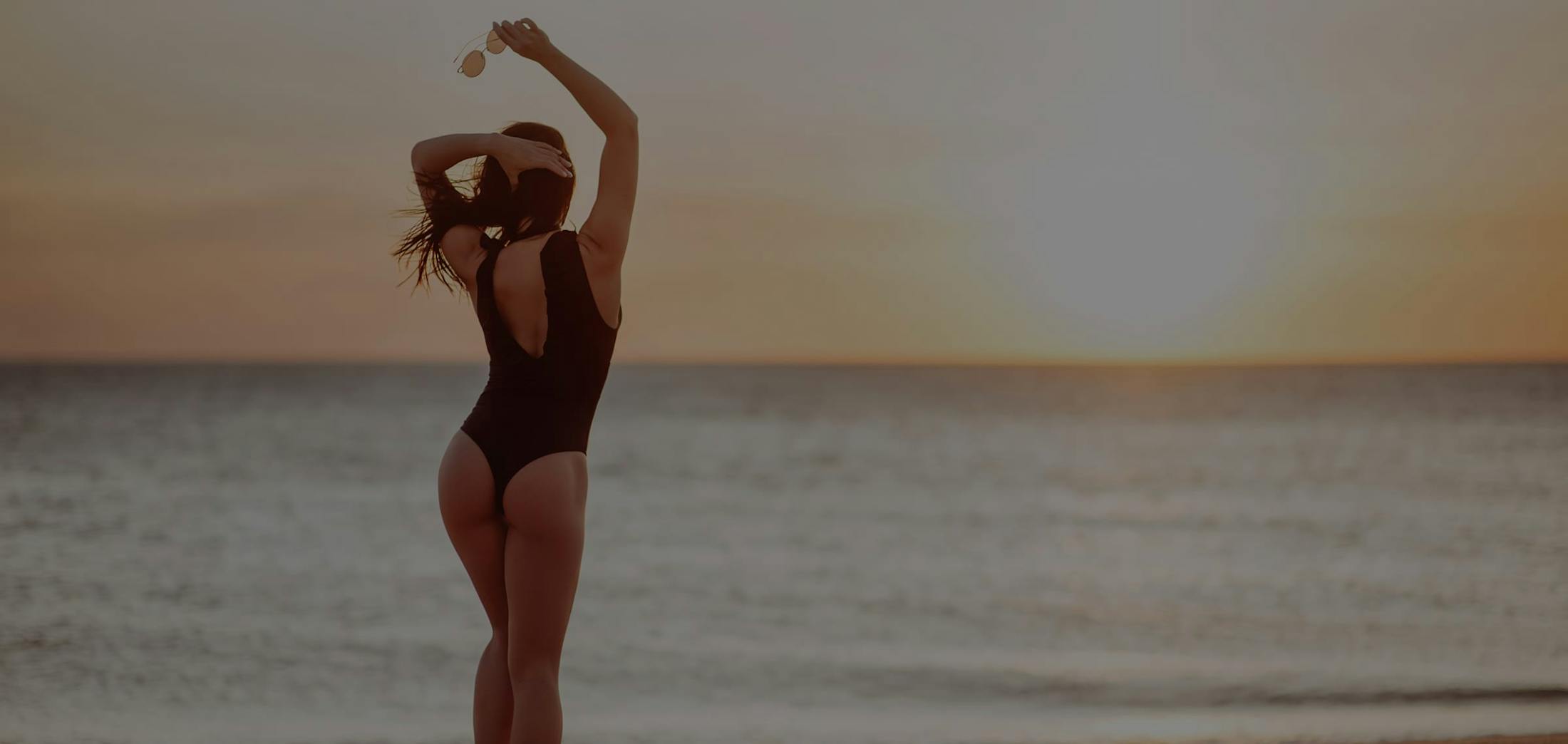 Woman in bathing suit at the beach