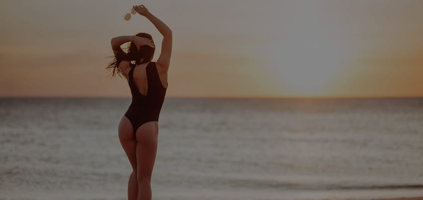 Woman in bathing suit at the beach