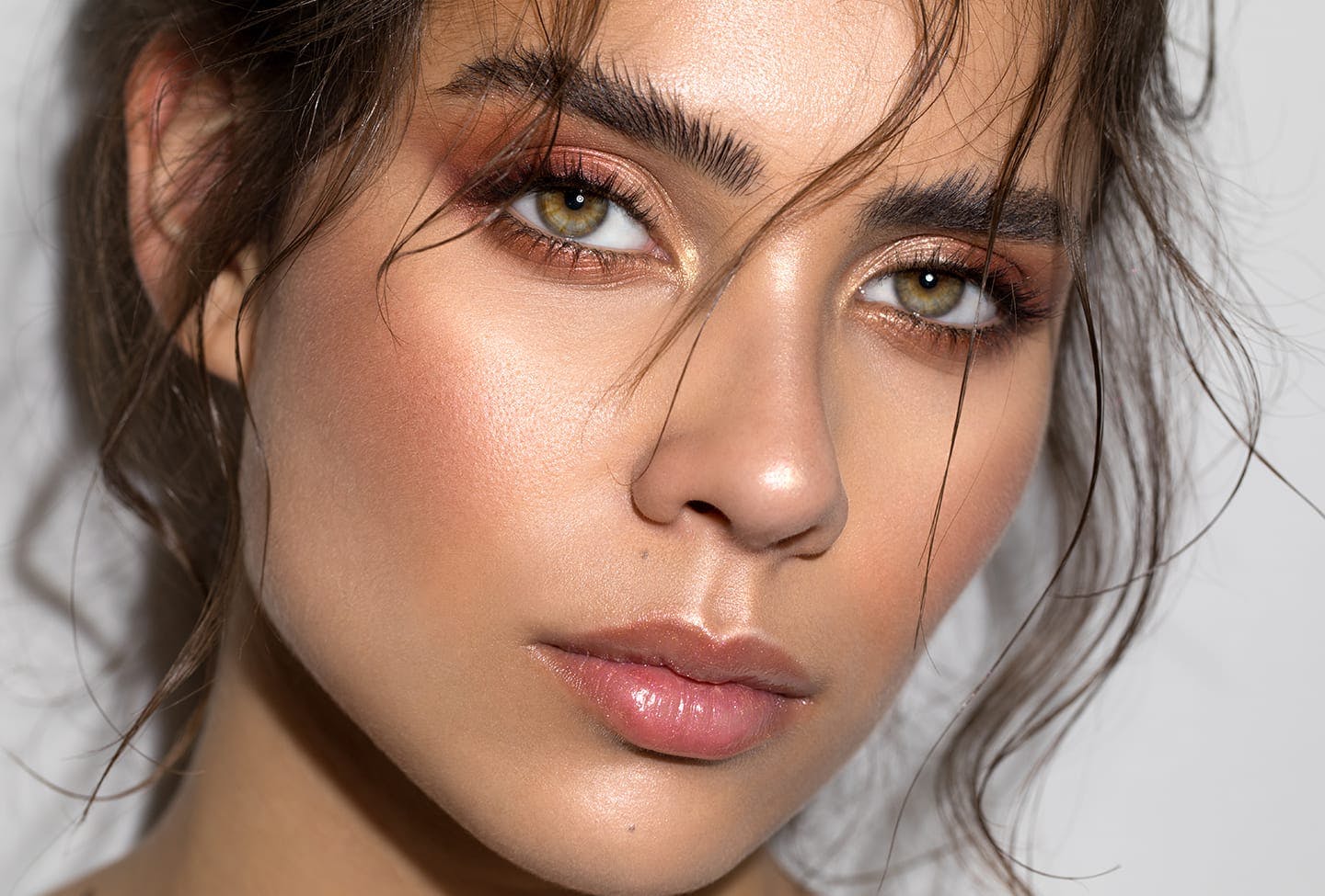 Up close of model that has a serious expression