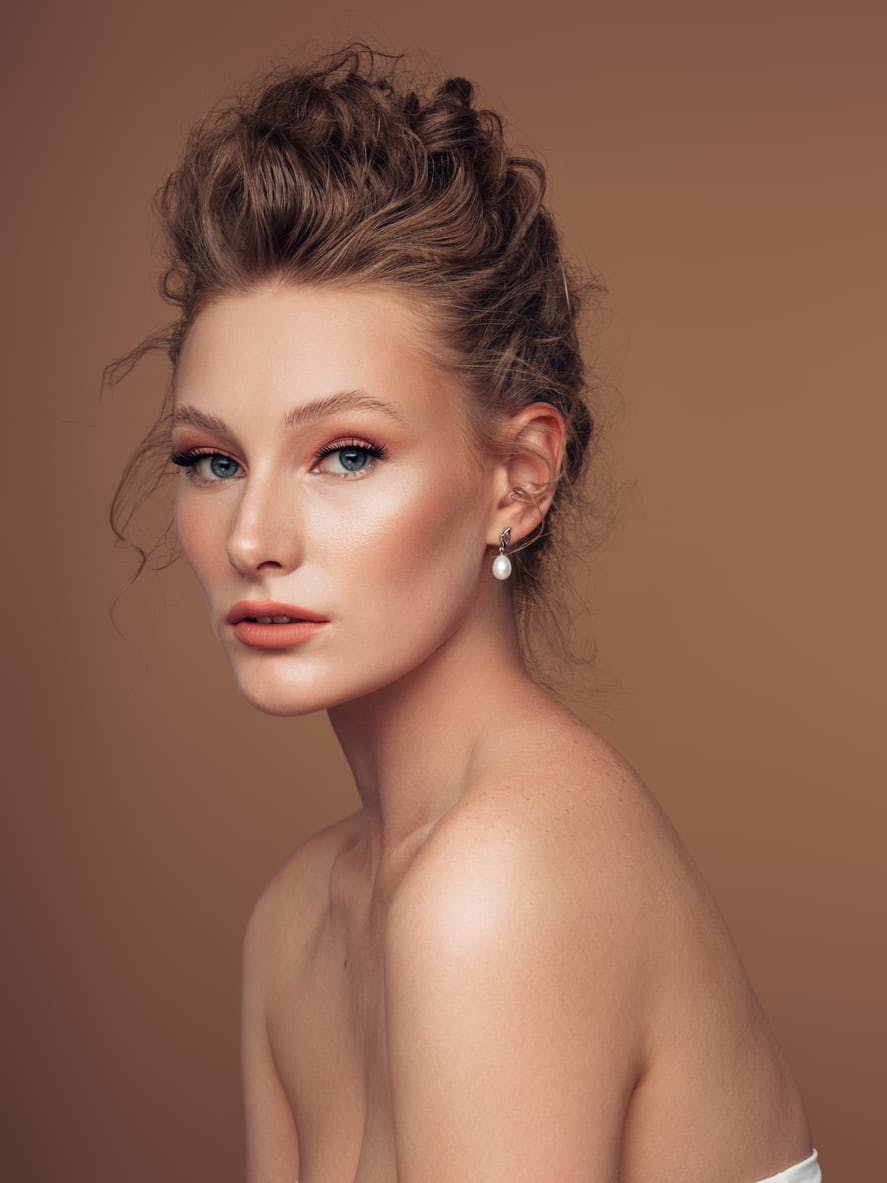 female model with brown background