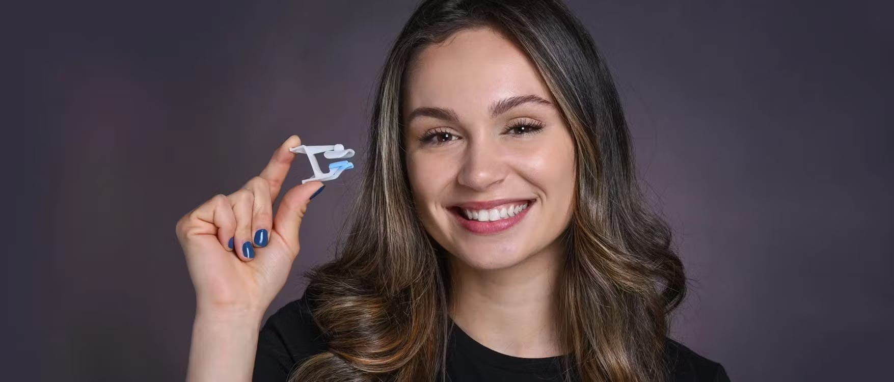 woman holding a device for the nose