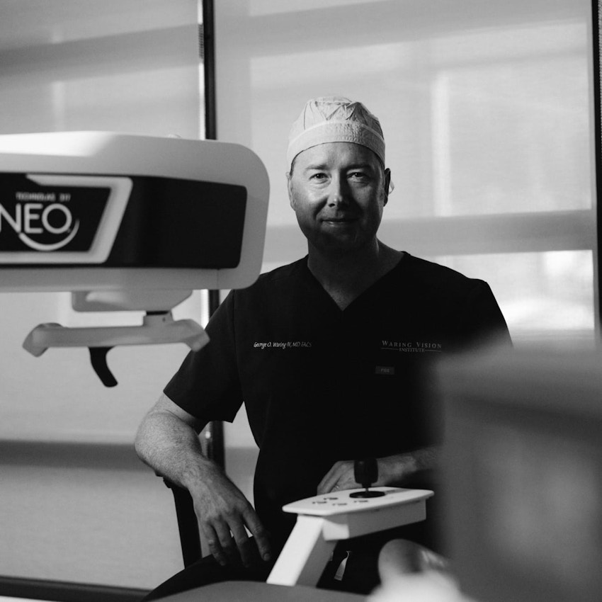 Dr. Waring sitting at equipment