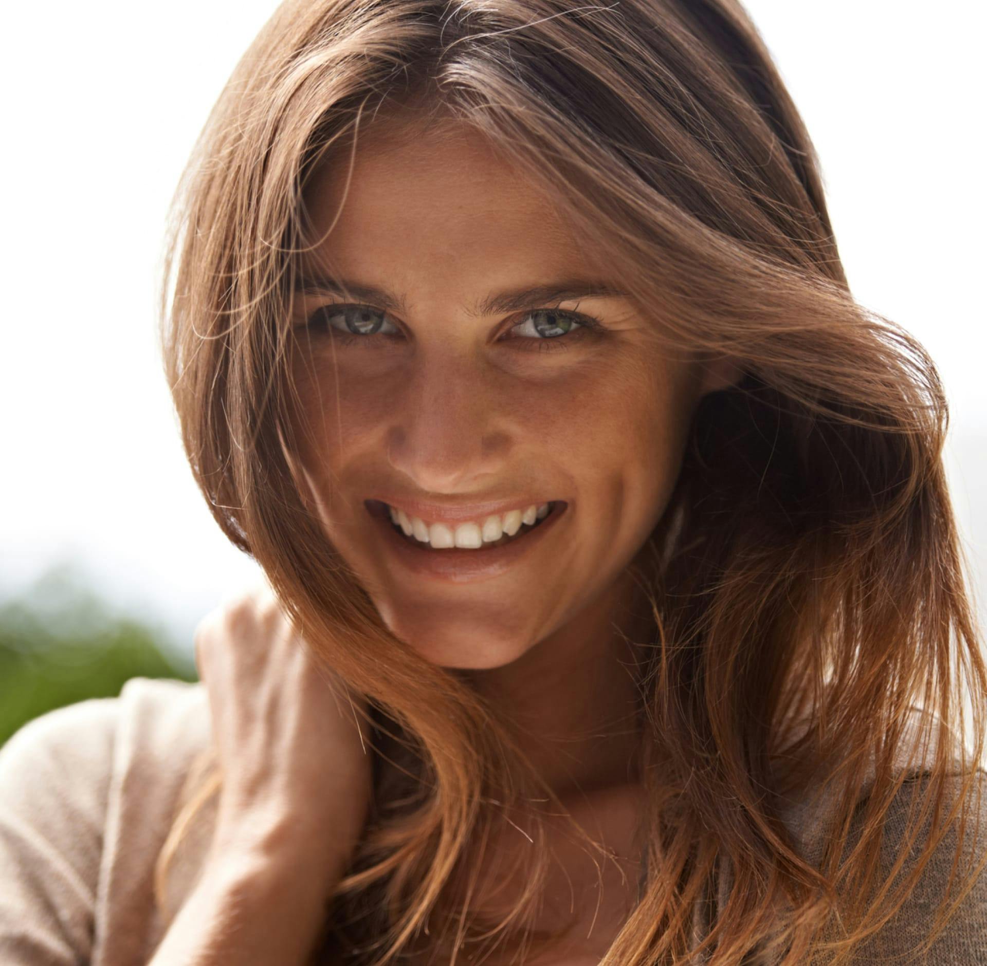 Woman smiling outside