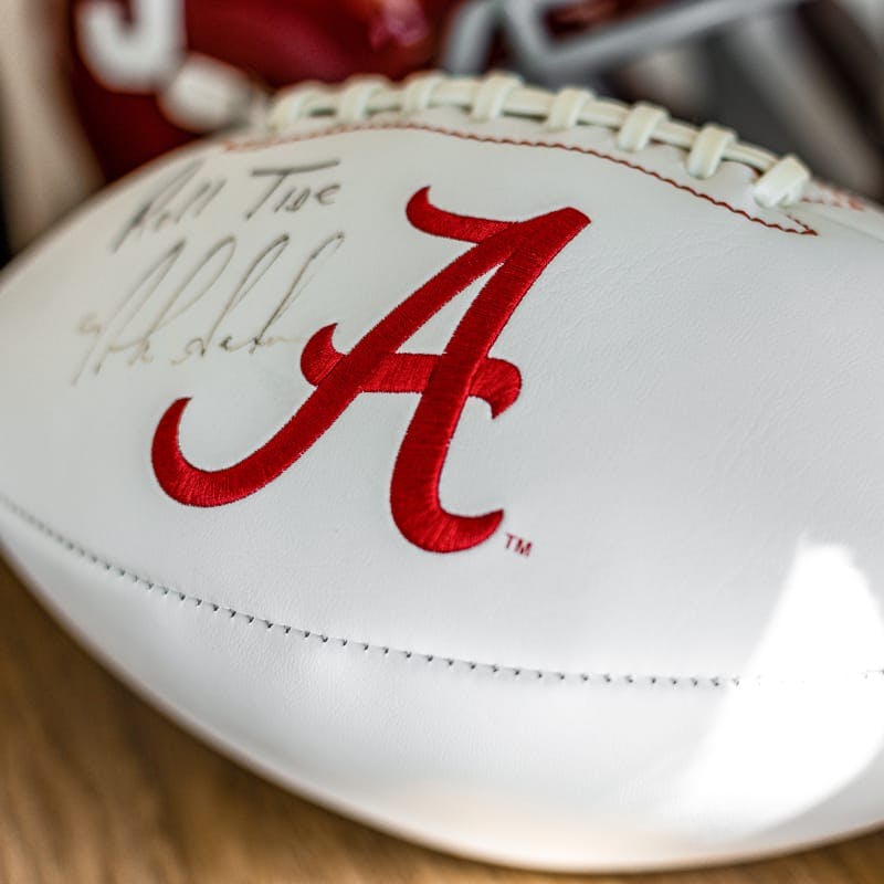 white football with signature and a cursive