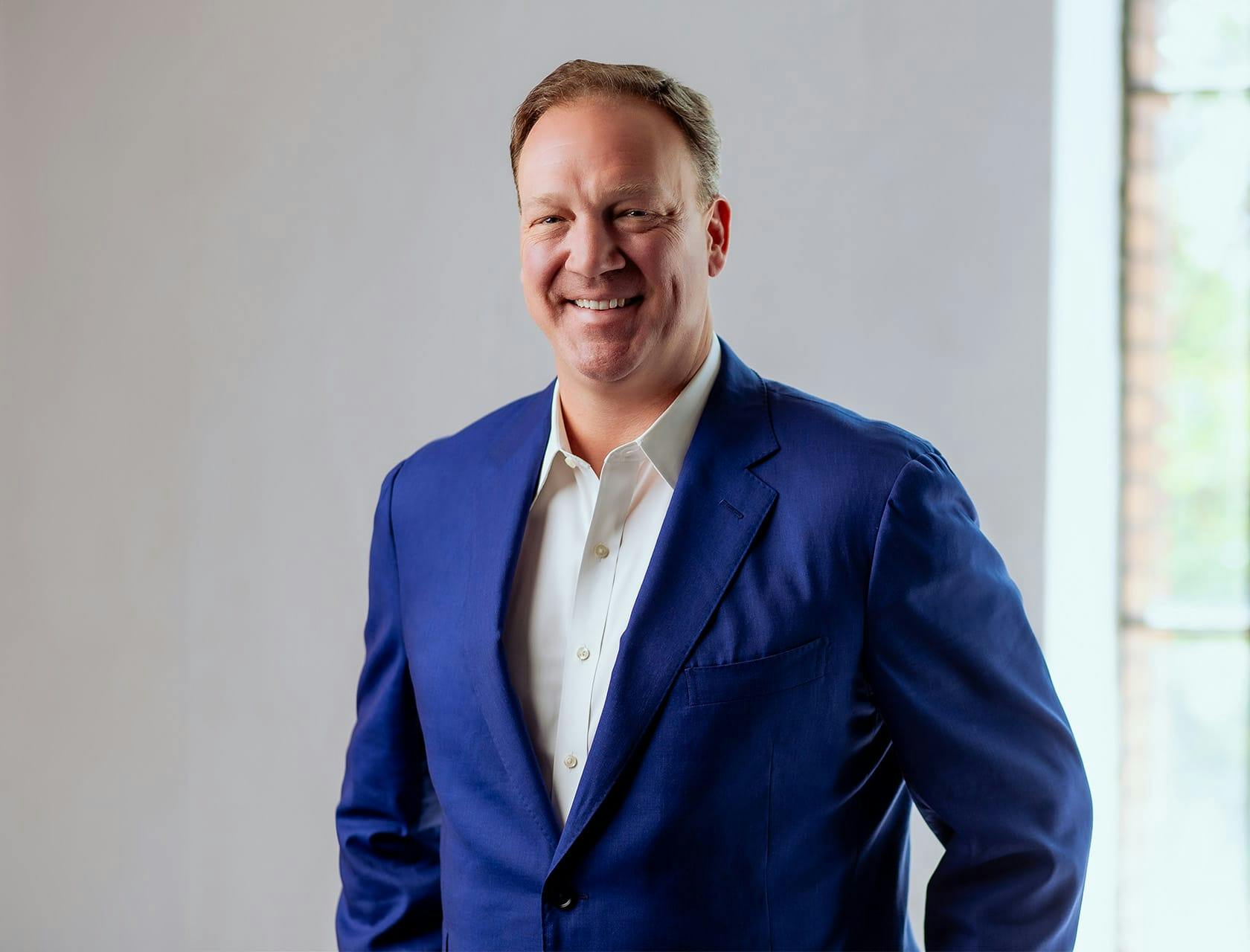 Brett Turnbull in blue suit