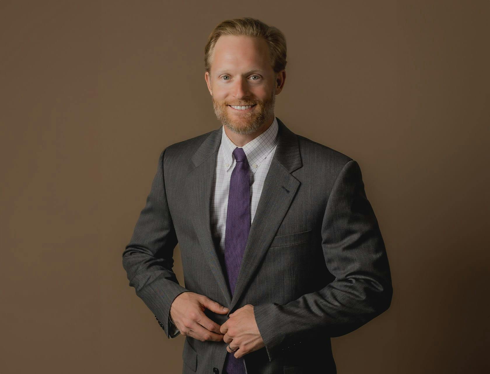 Robert Lemoine in gray suit