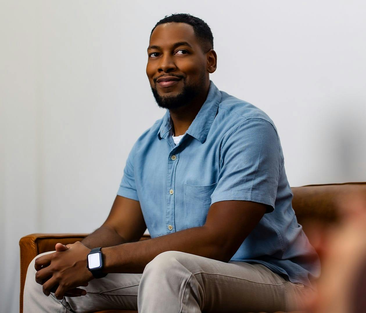 man sitting on couch