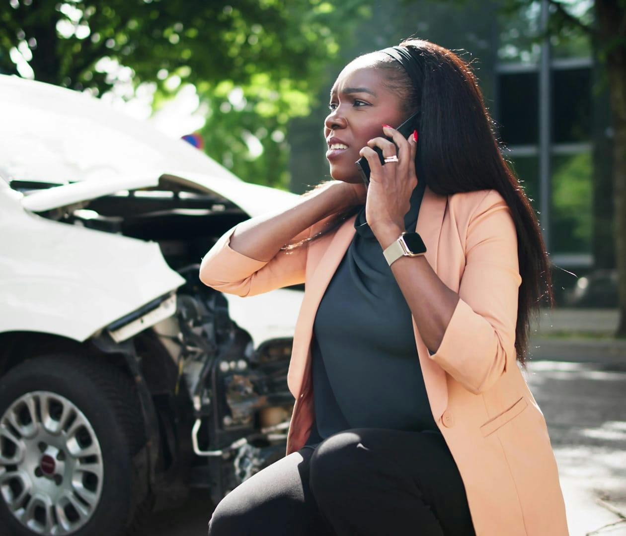 woman on the phone after being in a car wreck